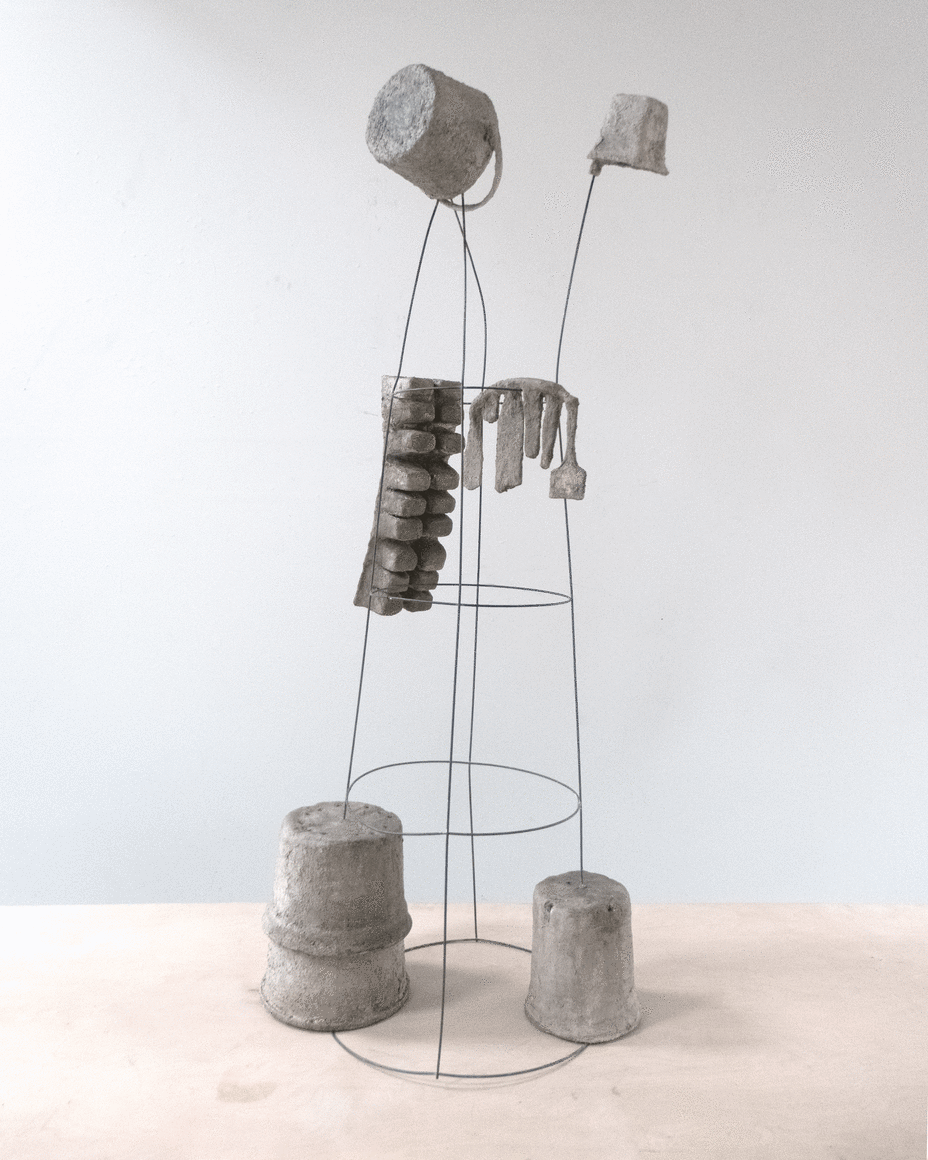 Erin Woodbrey  The Gardener (From the Carrier Bag Series), 2023  Single-use plastic containers, plant labels, ash, plaster, gauze, and steel wire  142.25 x 51 x 63.5 cm / 56 x 20 x 25 in