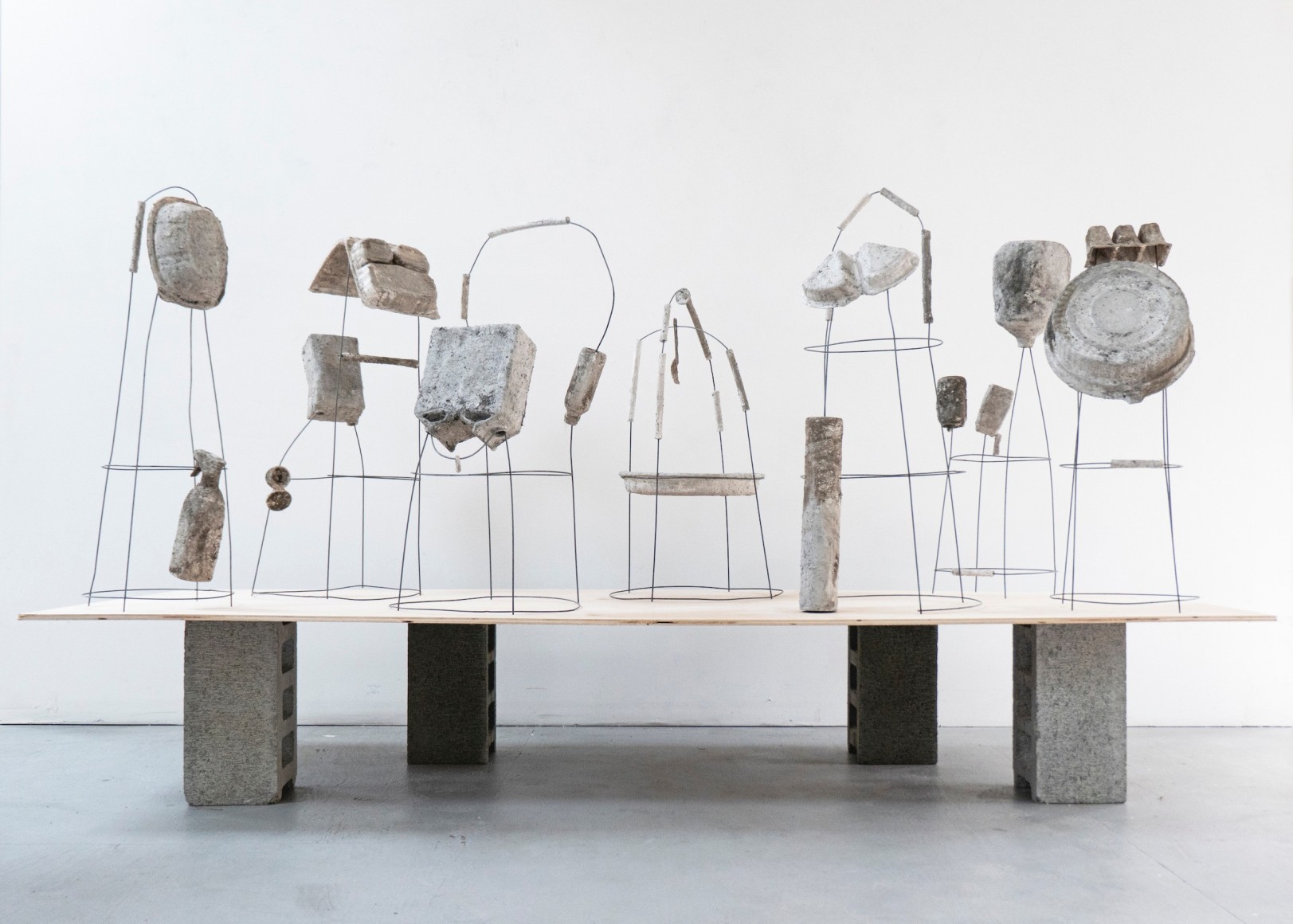 Erin Woodbrey  The Carrier Bag Series, 2020-2021  Single-use plastic, metal, and paper containers, foam, ash, plaster, and gauze  Variable Dimensions