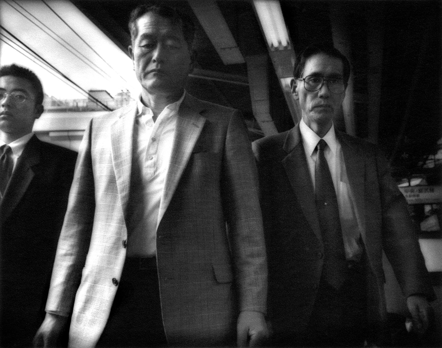 Salarimen, Yamanote Line, Shinjuko, Tokyo, Japan, 1996 - Mangaland | James Whitlow Delano Documentary Photography