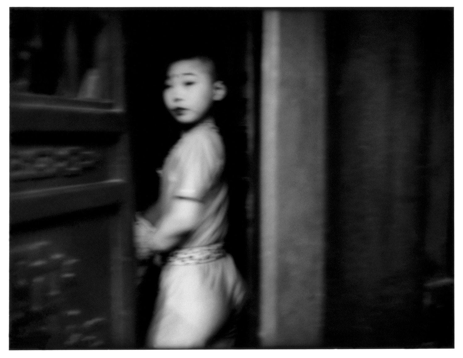 Suspicious glance from a young theatrical performer at the stage door - Empire | James Whitlow Delano Documentary Fine Art