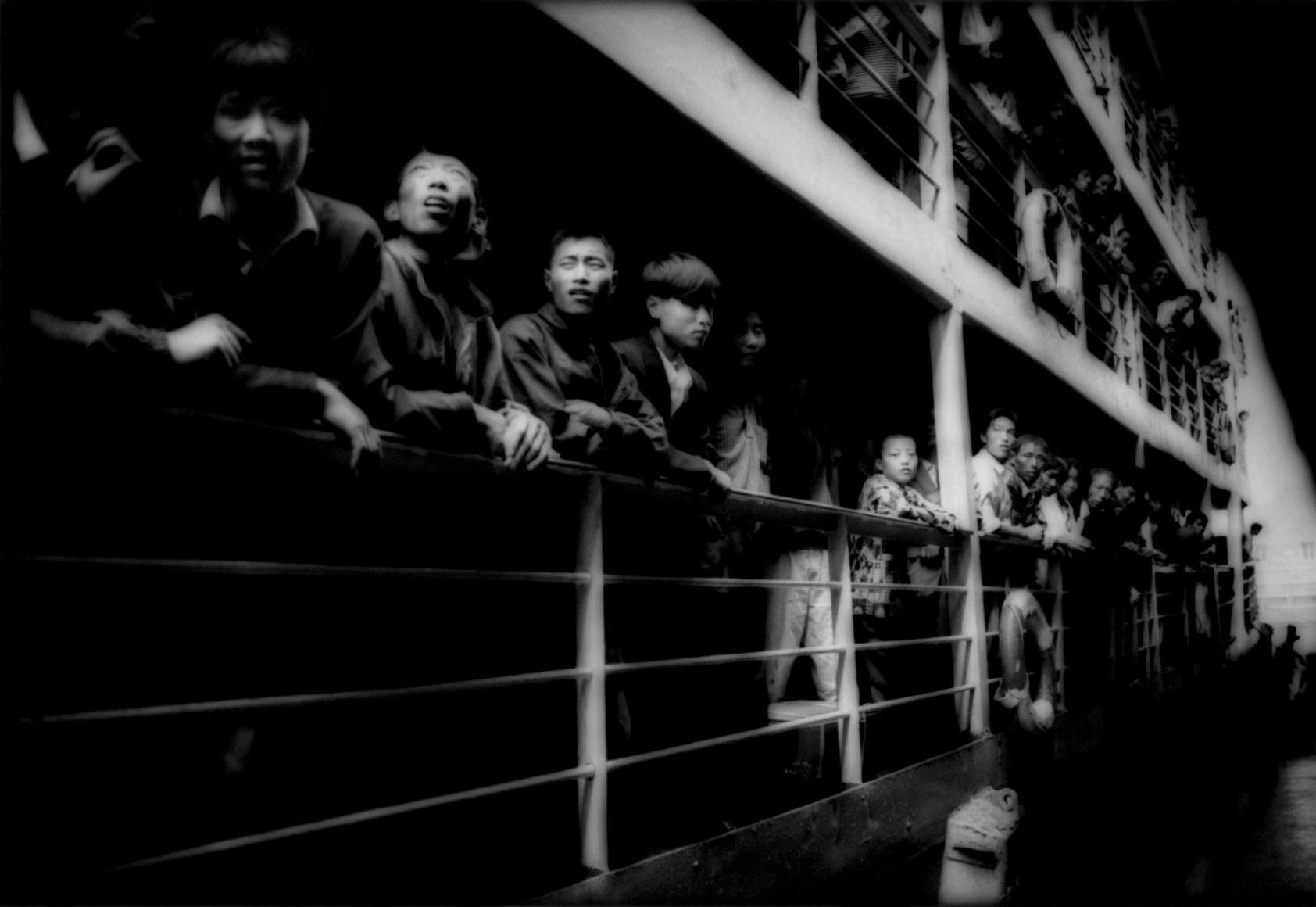 Peasants crowding the rails of a river steamer - Empire | James Whitlow Delano Documentary Fine Art