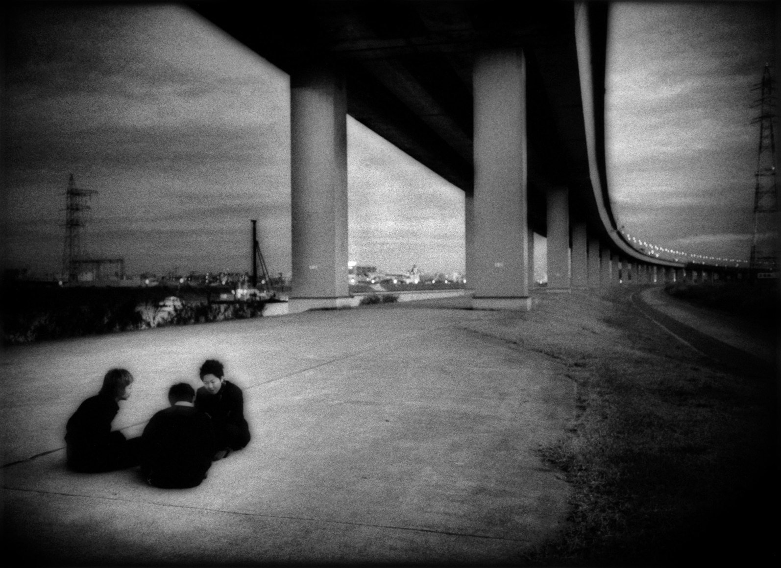 Conspiratorial schoolboys underneath expressway, Shin Koiwa, Tokyo, 2007 - Mangaland | James Whitlow Delano Documentary Photography