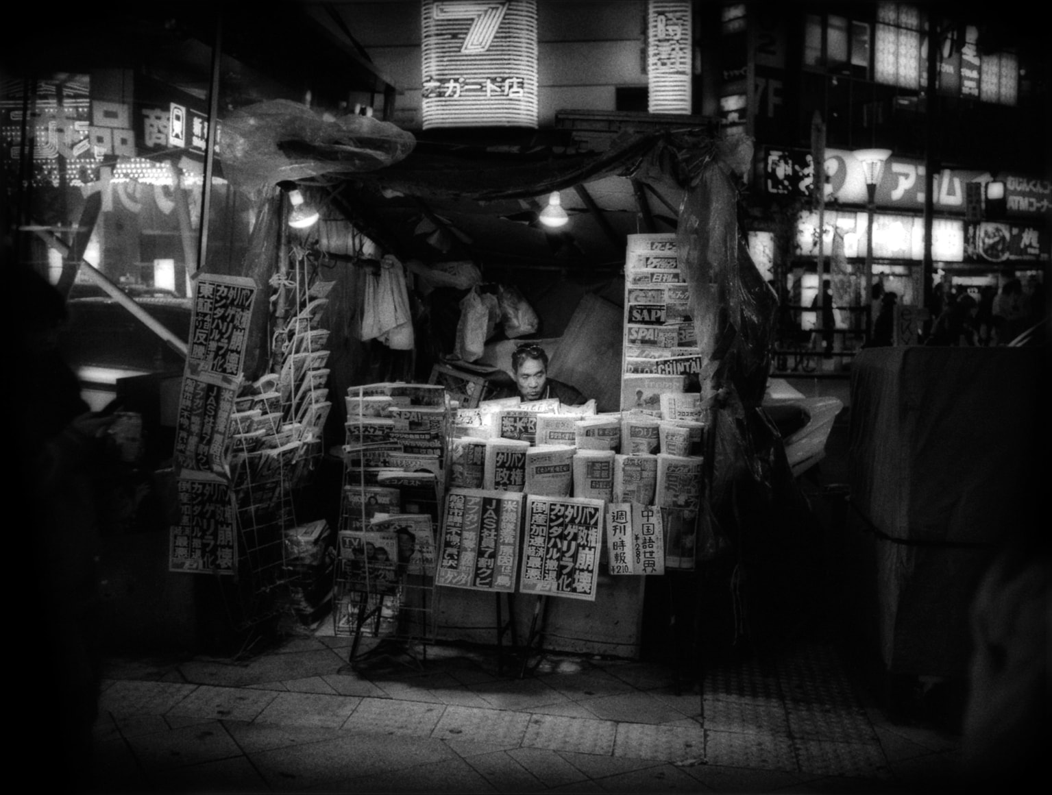 James Whitlow Delano, Mangaland, Newsstand at night, Shinjuko, Tokyo, Japan, 2002, Sous Les Etoiles Gallery