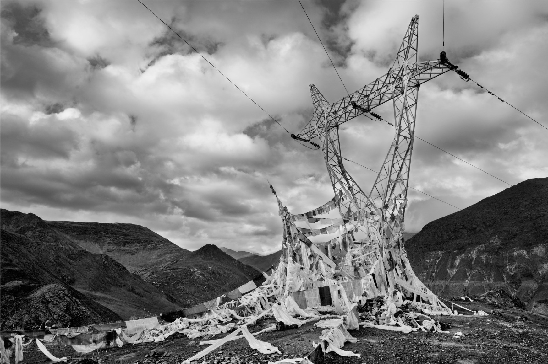 Laurent Zylberman, A Journey in Tibet, Prayer flags on power lines at the sacred lake Yamdrok-Tso, 2008, Sous Les Etoiles Gallery