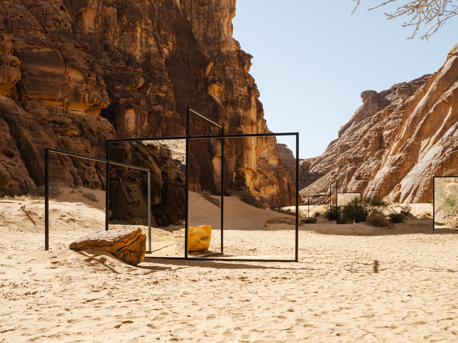 Alicja Kwade, In Blur, 2022, powdered coated steel, mirror, stones, trees and other natural elements. Installation view: Desert X AlUla, 2022. Photo by Lance Gerber. 
