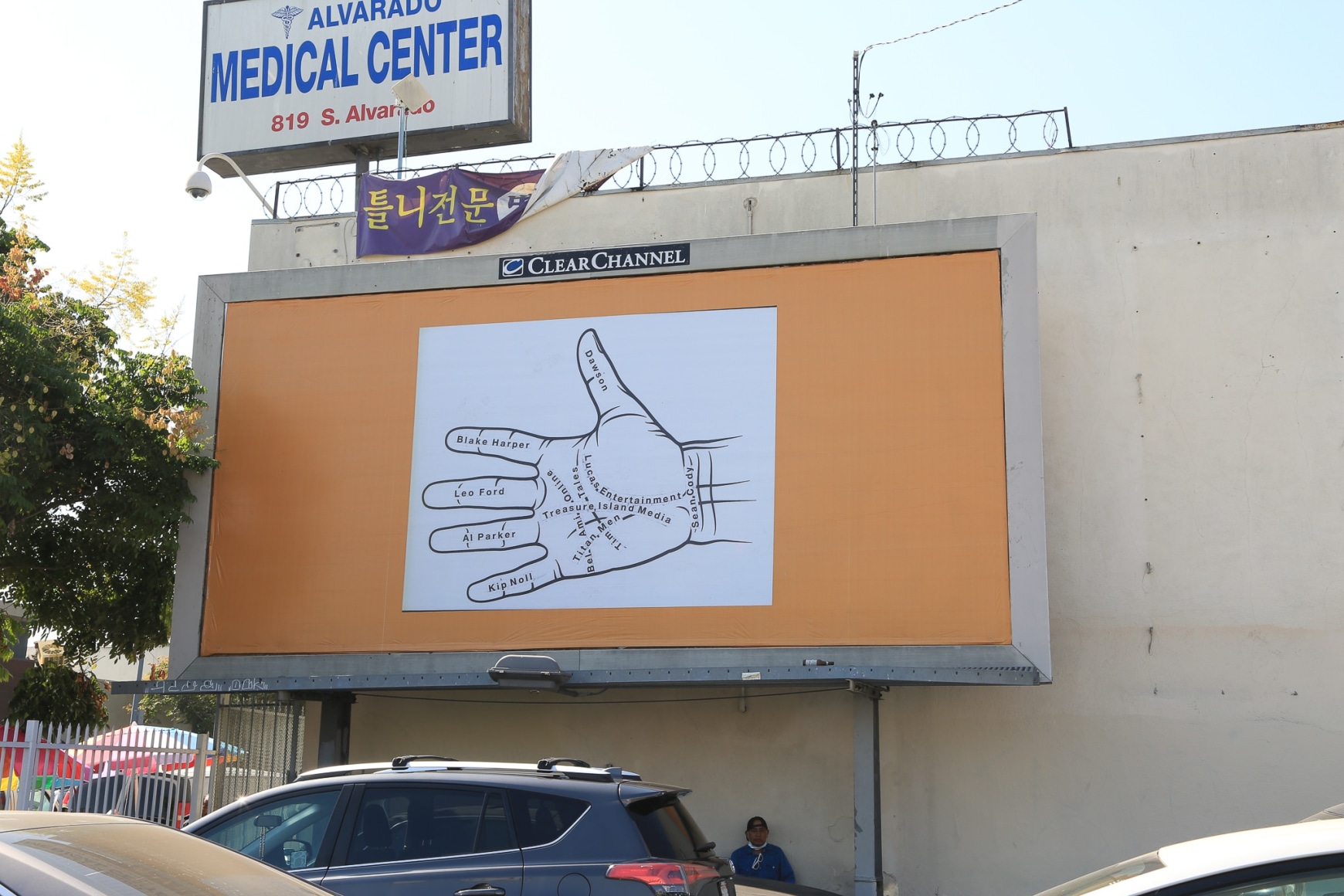Larry Johnson, Palmistry 2, 2020. Billboard at W. Eighth St. and S. Alvarado St., Los Angeles, 90057 (facing north). 144 × 288 in. (365.8 × 731.5 cm). Courtesy of the artist, David Kordansky Gallery, Los Angeles, and 303 Gallery, New York. Installation view, co-produced by The Billboard Creative for Made in L.A. 2020: a version. Photo: Joshua White / JWPictures.com