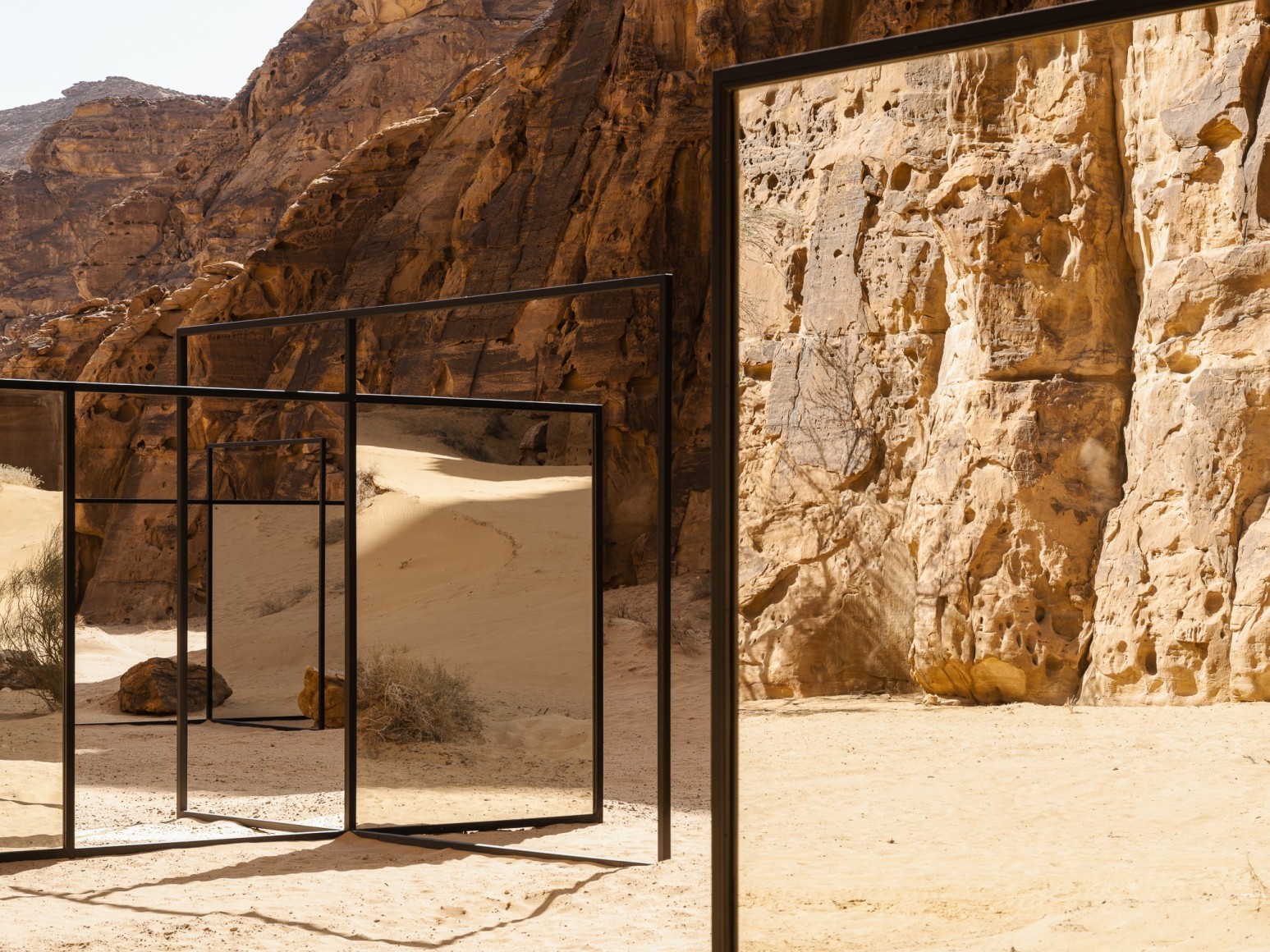 Alicja Kwade, In Blur, 2022, powdered coated steel, mirror, stones, trees and other natural elements. Installation view: Desert X AlUla, 2022. Photo by Lance Gerber. 