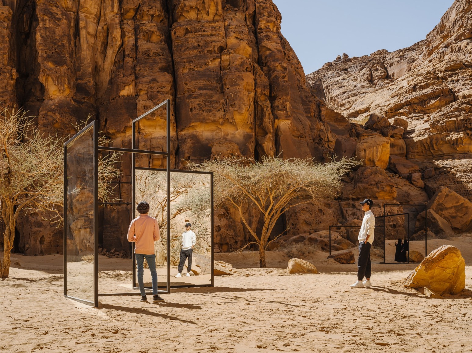 Alicja Kwade, In Blur, 2022, powdered coated steel, mirror, stones, trees and other natural elements. Installation view: Desert X AlUla, 2022. Photo by Lance Gerber. 