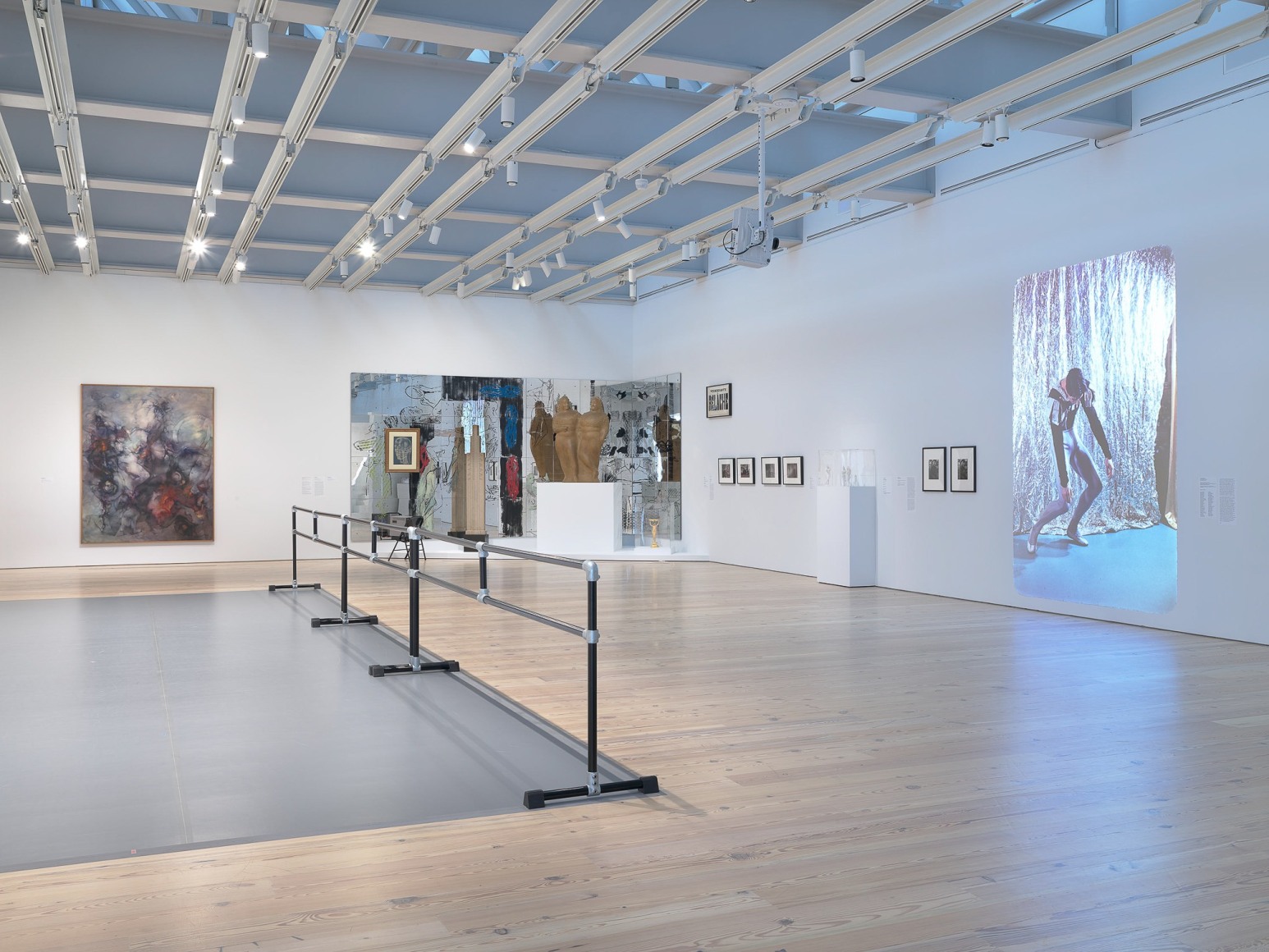 Installation view of Nick Mauss: Transmissions, Whitney Museum of American Art, New York, 3/16 - 5/14/2018, Left to right: Dorthea Tanning, Aux environs de Paris (Paris and Vicinity), 1962; Nick Mauss, Images in Mind, 2018; Documentation of George Balachine chorerography in rehearsals, 1951-58; Pavel Tchelitchew, Interior Landscape Skull, 1949; John Storrs, Forms in Space #1, c. 1924; Elie Nadelman, Two Circus Women, c. 1928-29; Gustav Natorp figure (formerly owned by Lincoln Kirstein), 1898; Sturtevant, Relâche, 1967; Ilse Bing, Untitled (Skyscrapers, night, NY), 1936; Ilse Bing, Dead End II, 1936.; Ilse Bing, Three Birds in the Sky, Paris, 1936; Ilse Bing, Between France and U.S.A. (Seascapes), 1936; Elie Nadleman, Untitled, c. 1938-46; Elie Nadelman, Untitled, c. 1938-46; Elie Nadelman, Untitled, c. 1938-46; Elie Nadelman, Untitled, c. 1938-46; Carl Van Vechten, Al Bledger of the Von Grona (American) Negro Ballet, 1938; Carl Van Vechten, Al Bledger of the Von Grona (American) Negro Ballet, 1938; Carl Van Vechten, Carl Van Vechten slideshow, 1940-64. Photograph by Ron Amstutz. Digital image © Whitney Museum of American Art, New York