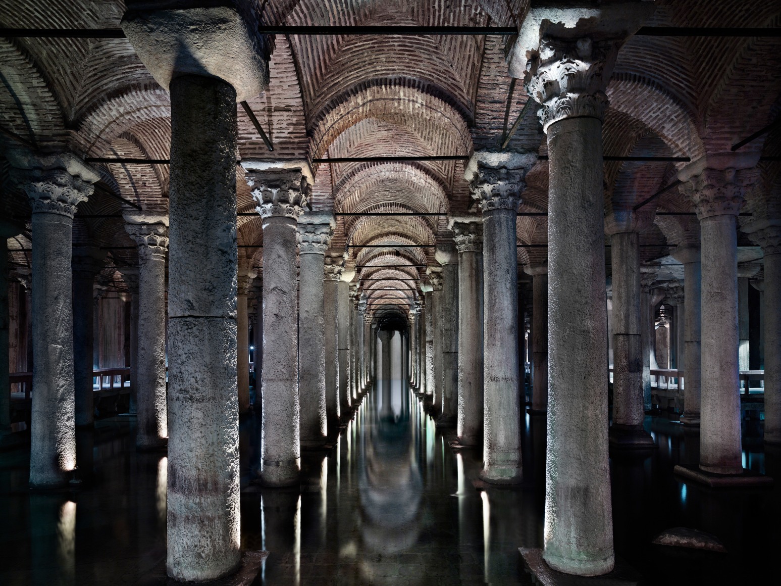 Color photo of a series of old and immense stone columns