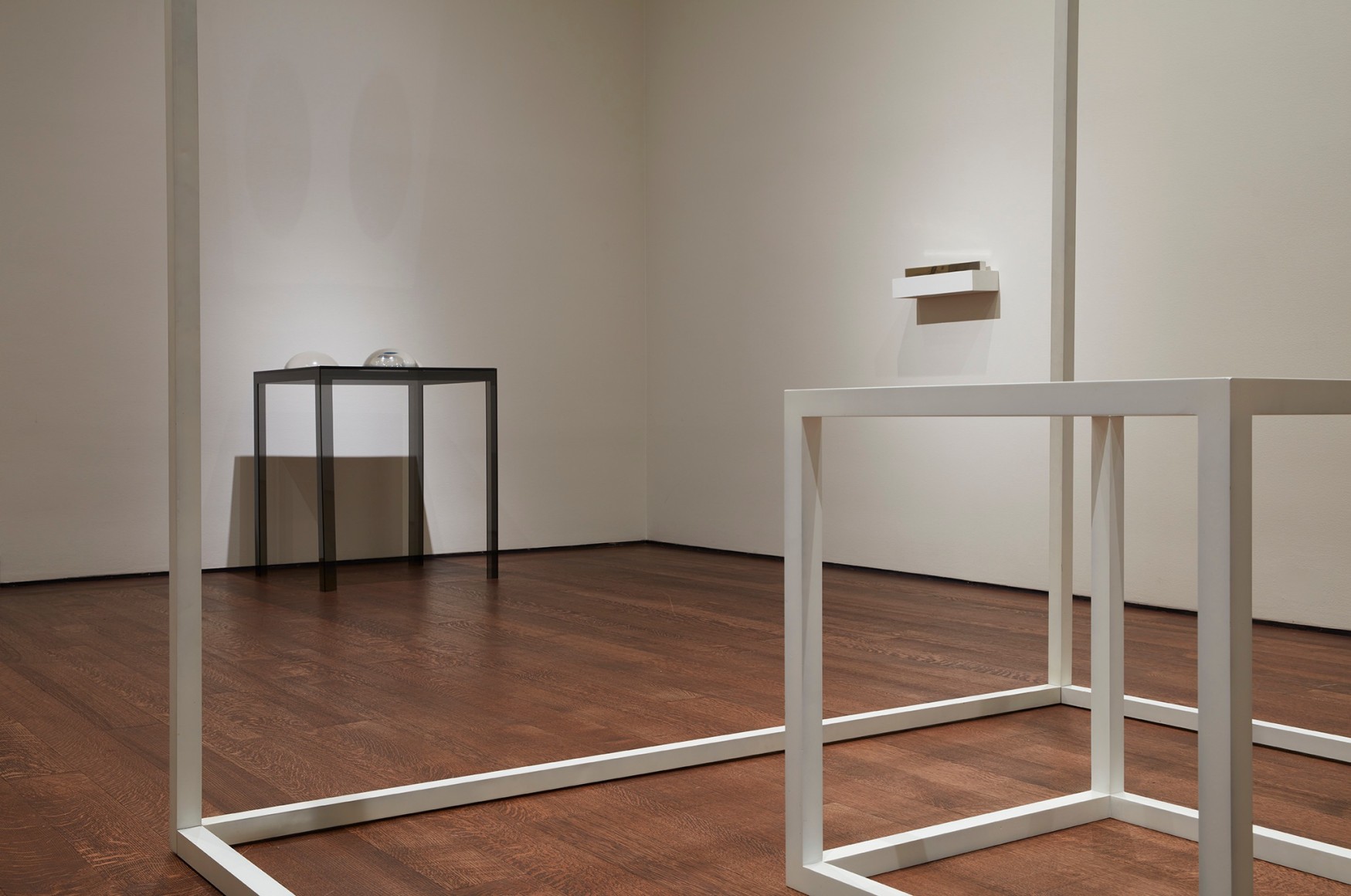 Judy Chicago, Clear Domes on Dark Base,&nbsp;1968; Sol LeWitt,&nbsp;#8,&nbsp;1966; and Walter De Maria, High Energy Bar,&nbsp;1966,&nbsp;on view in&nbsp;less: minimalism in the 1960s.