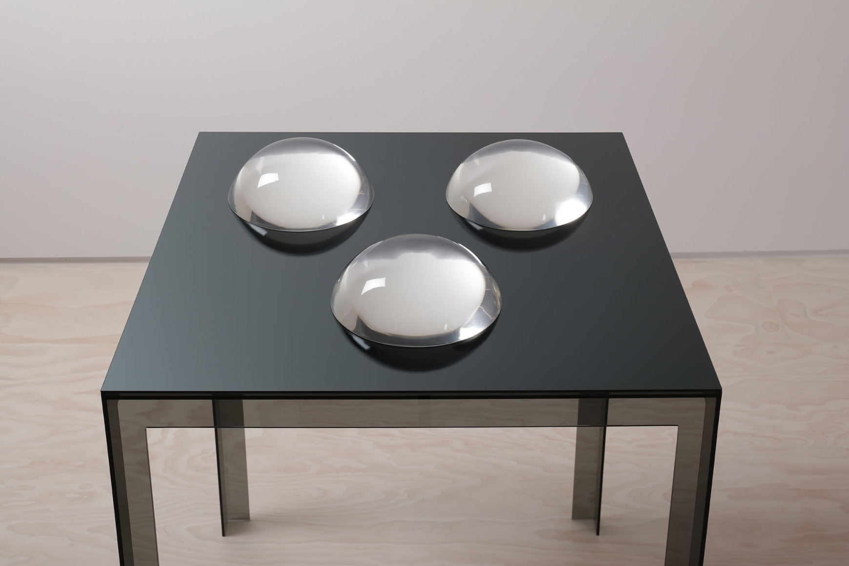 Judy Chicago Clear Domes on Dark Base, 1968 Clear acrylic domes on mirrored glass on Plexiglas base Overall dimensions: 38 &frac14; x 30 x 30 inches (97.2 x 76.2 x 76.2 cm) Table: 34 1/2 x 30 x 30 inches (87.6 x 76.2 x 76.2 cm) Each dome: 3 &frac34; x 8 7/8 inches (9.5 x 22.5 cm) Courtesy of the artist and Jessica Silverman, San Francisco Photo: Mark Serr &copy; 2023 Judy Chicago / Artists Rights Society (ARS), New York