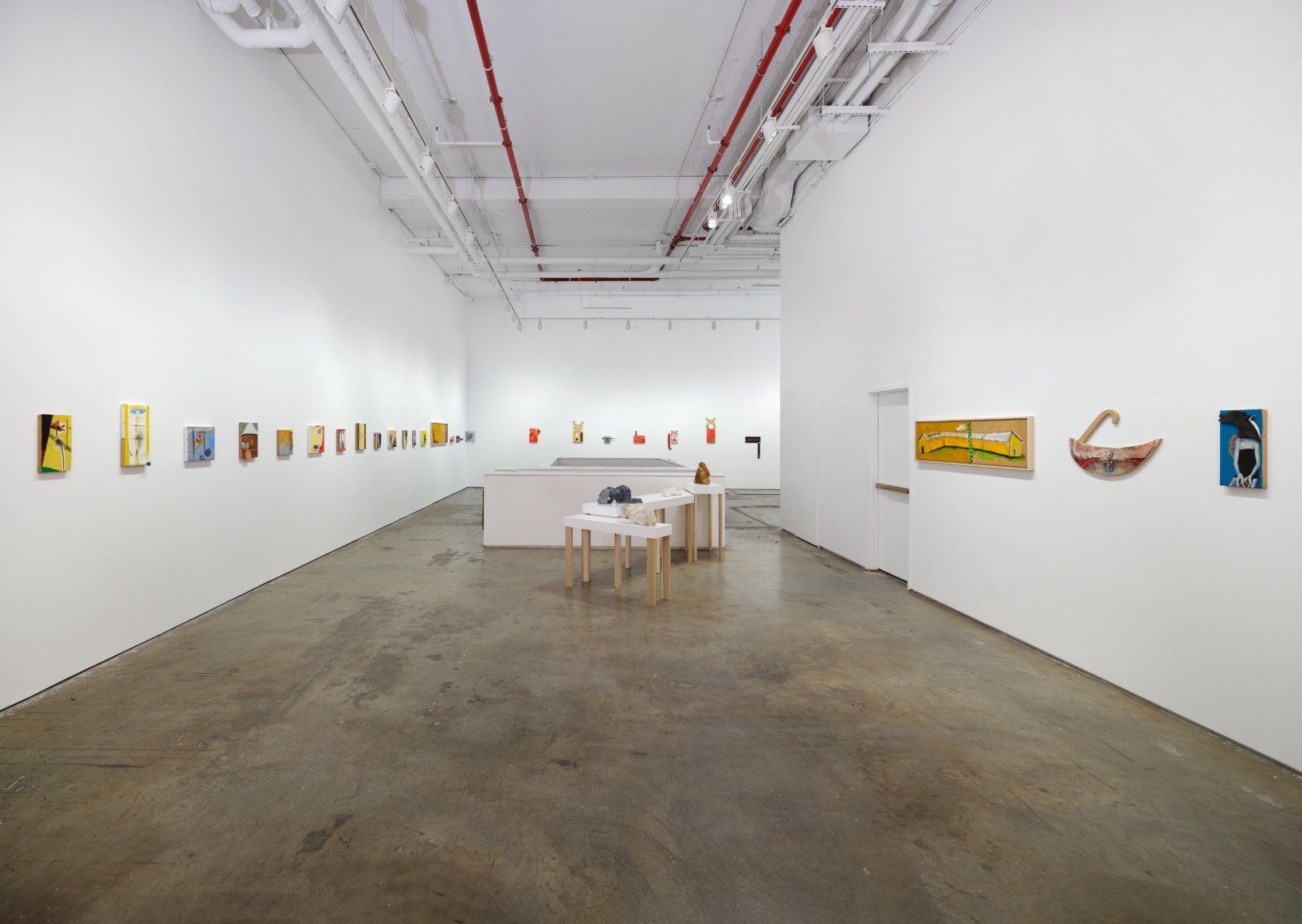 Gallery installation view featuring works by artist Enzo Cucchi