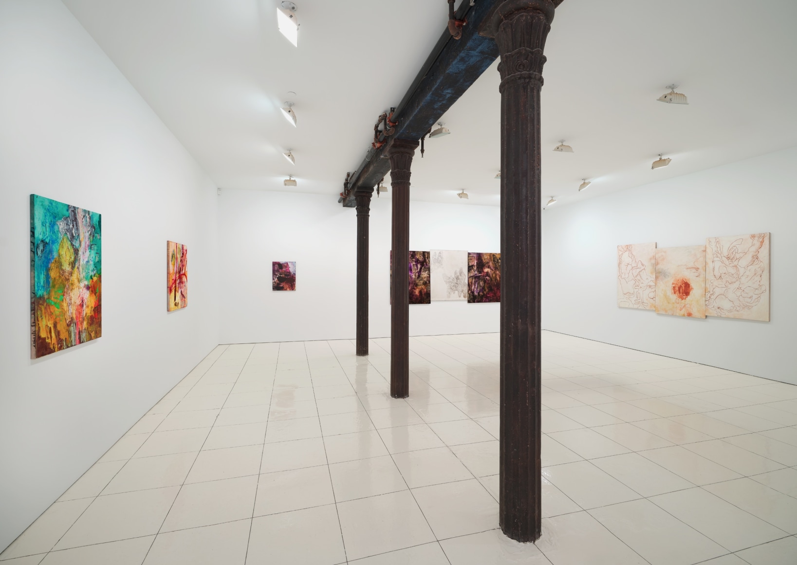 Installation view of Bill Jensen's Wandering Boundless and Free featuring colorful, abstract paintings