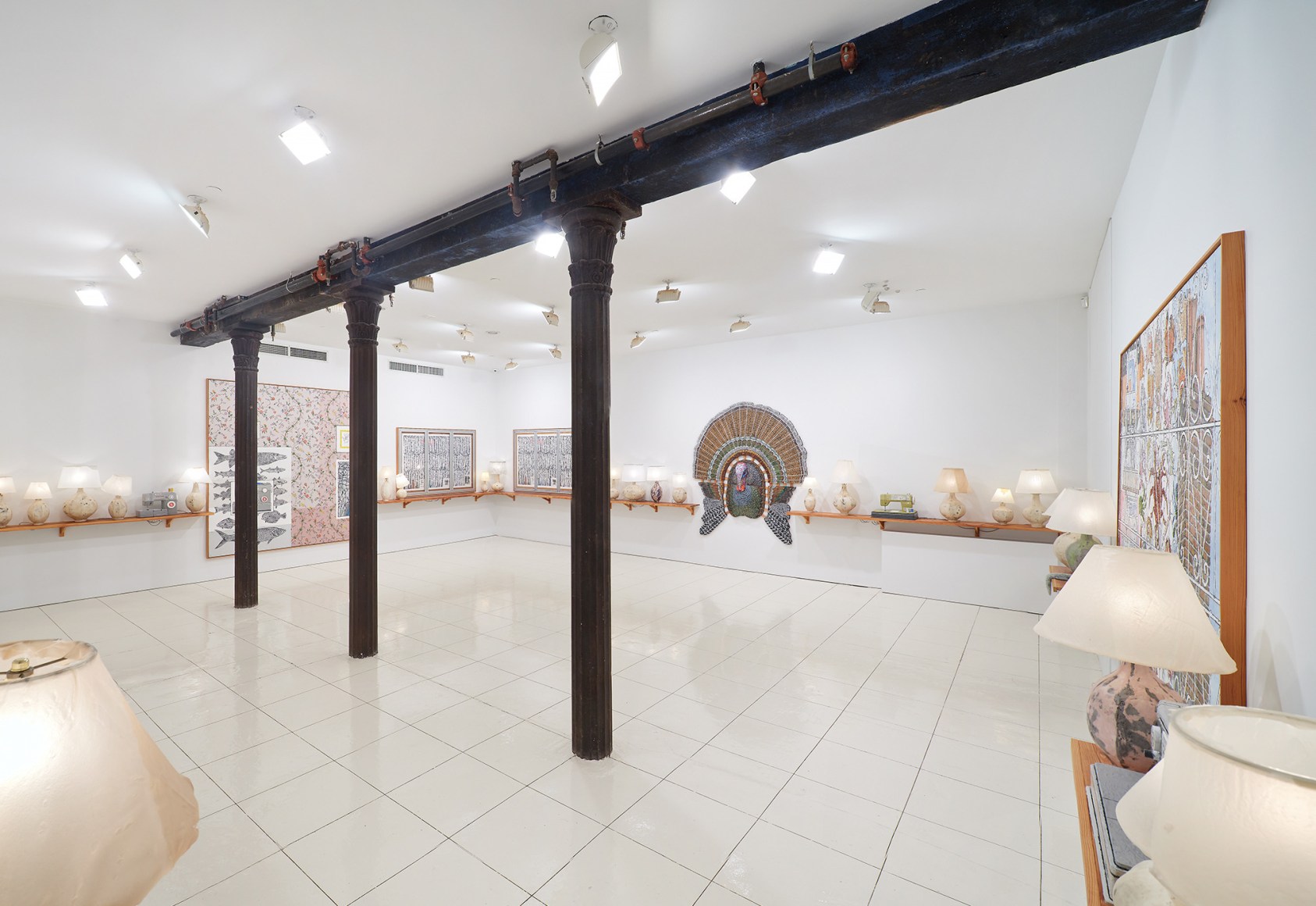 Installation view of Zachary Armstrong: New Work, featuring turkey sculpture, lamps, paintings, and sewing machine sculptures by Zachary Armstrong
