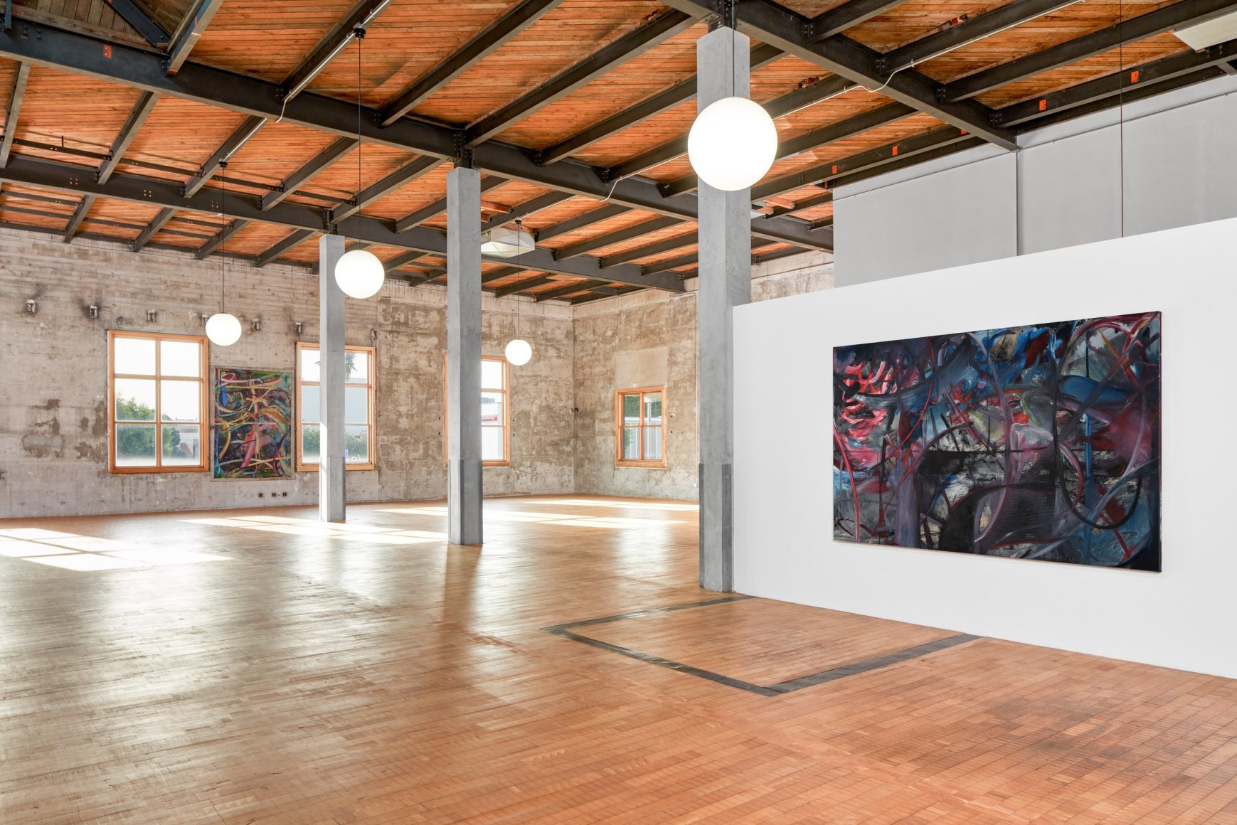 Installation view of Mariana Oushiro Paintings in a post office
