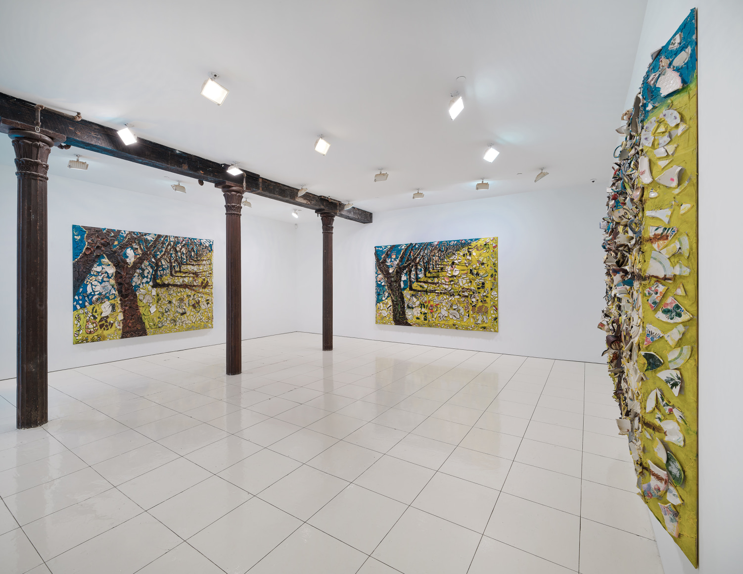 Installation view of Julian Schnabel plate paintings of trees