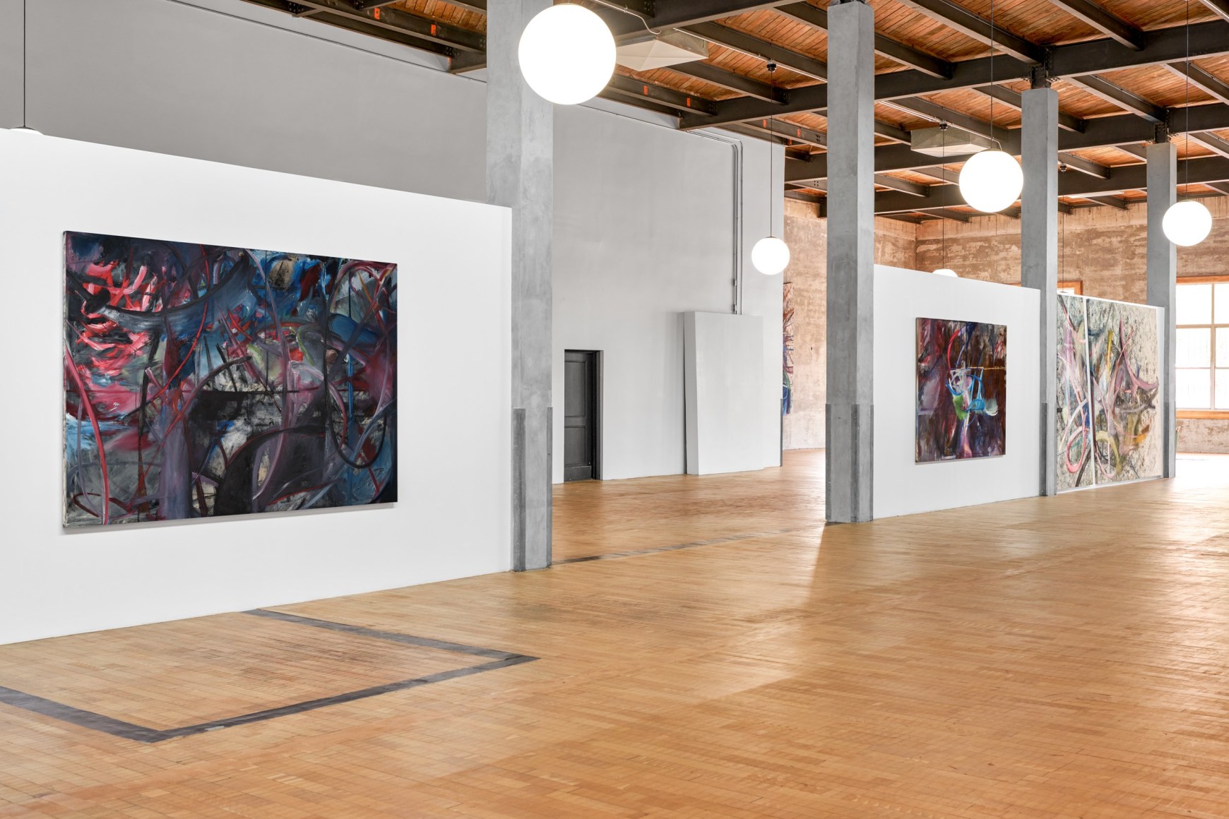 Installation view of Mariana Oushiro Paintings in a post office