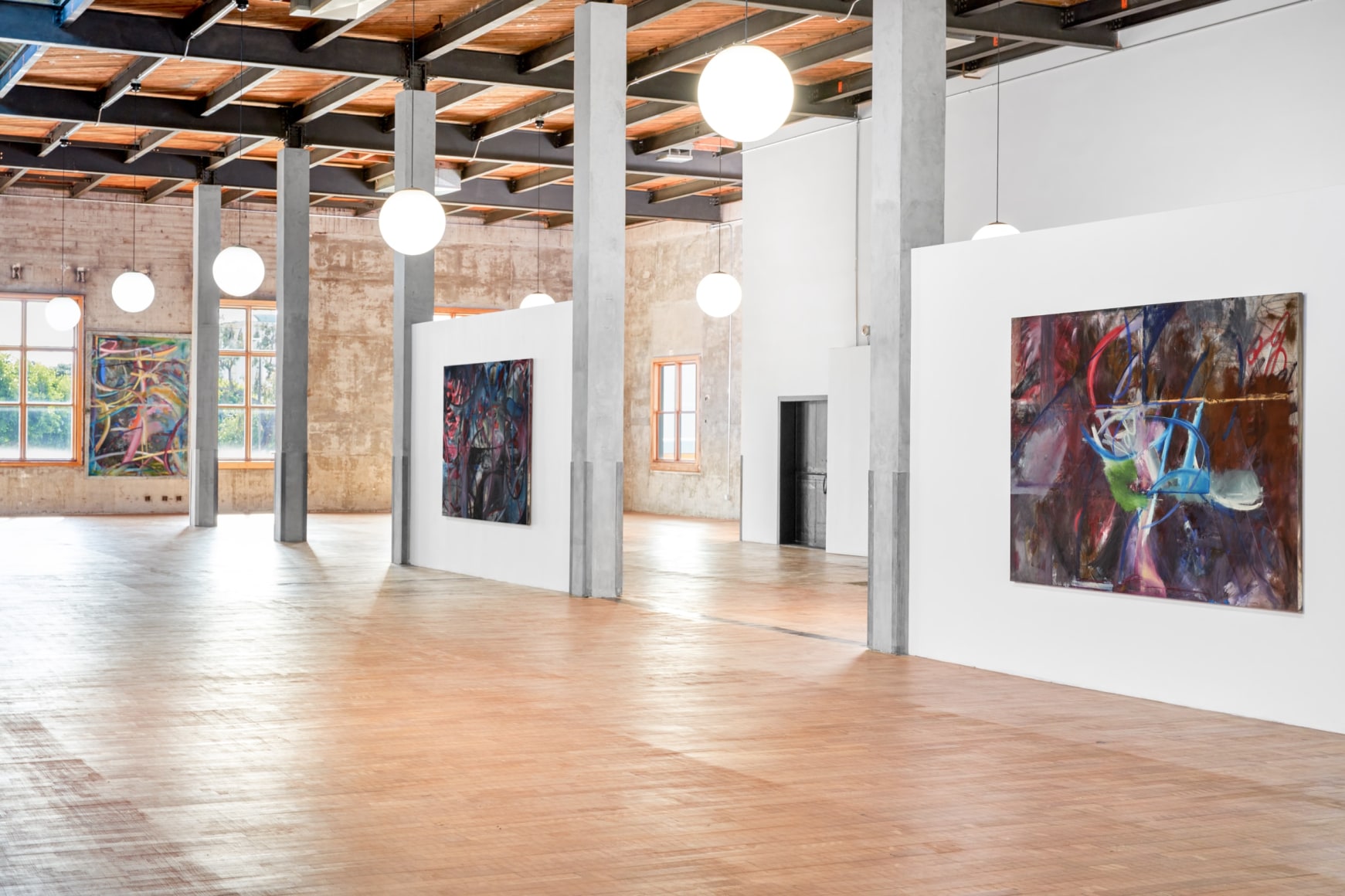 Installation view of Mariana Oushiro Paintings in a post office
