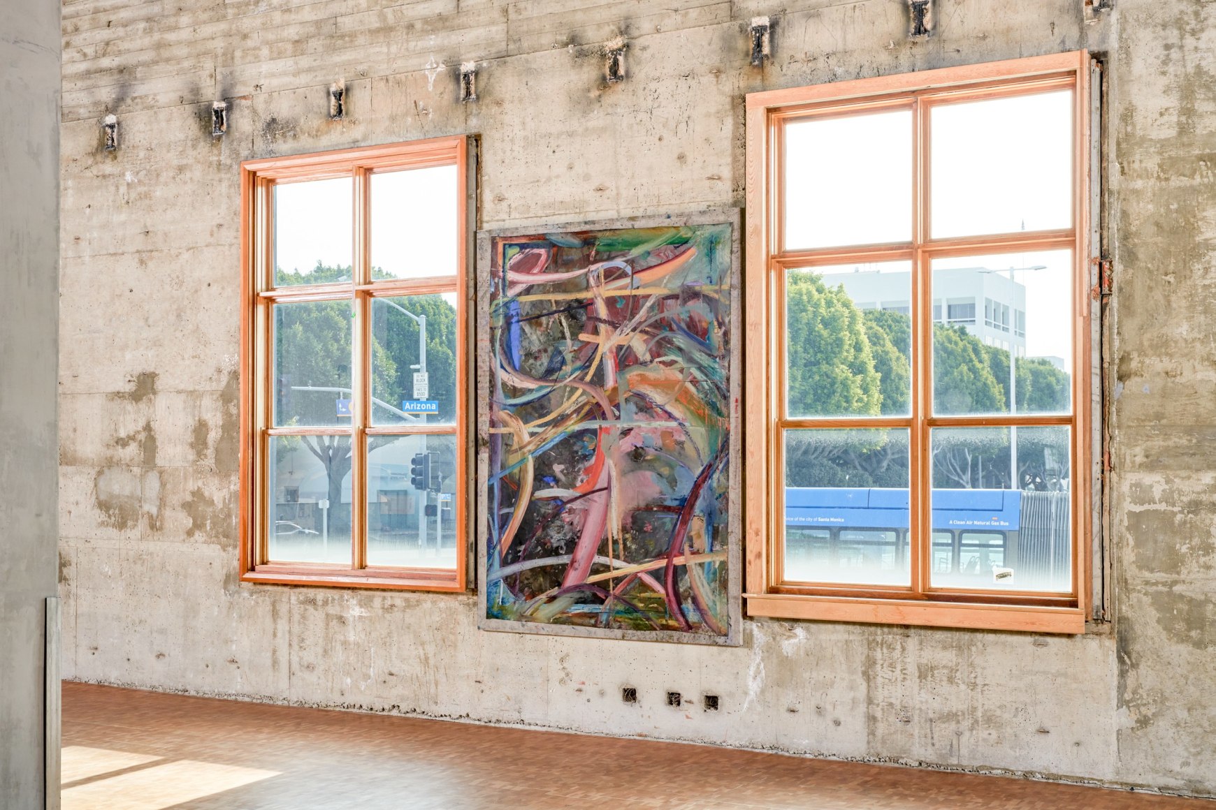 Installation view of Mariana Oushiro Paintings in a post office