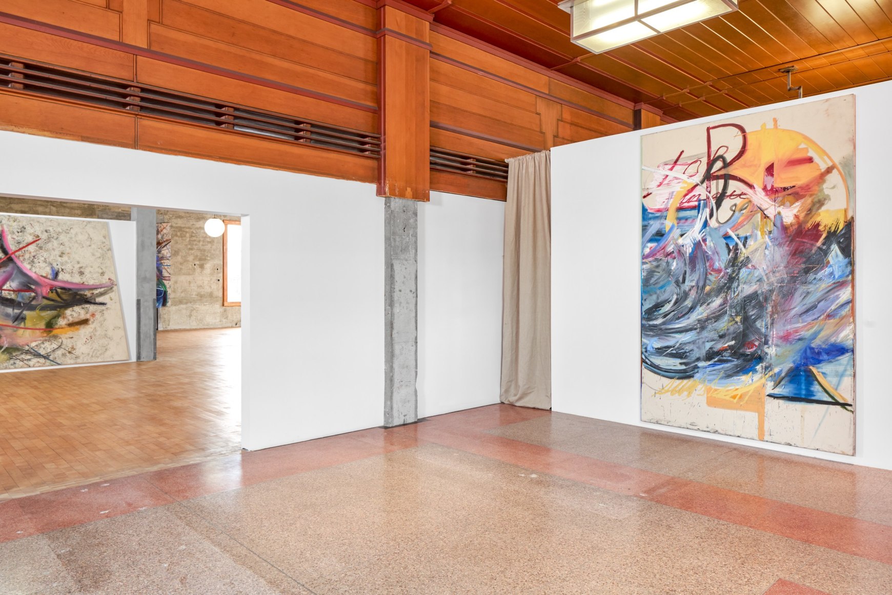 Installation view of Mariana Oushiro Paintings in a post office