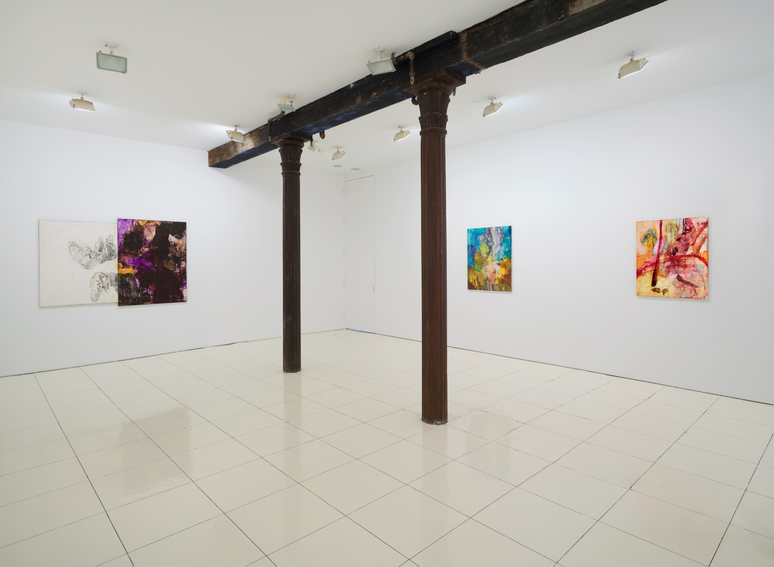 Installation view of Bill Jensen's Wandering Boundless and Free featuring colorful, abstract paintings