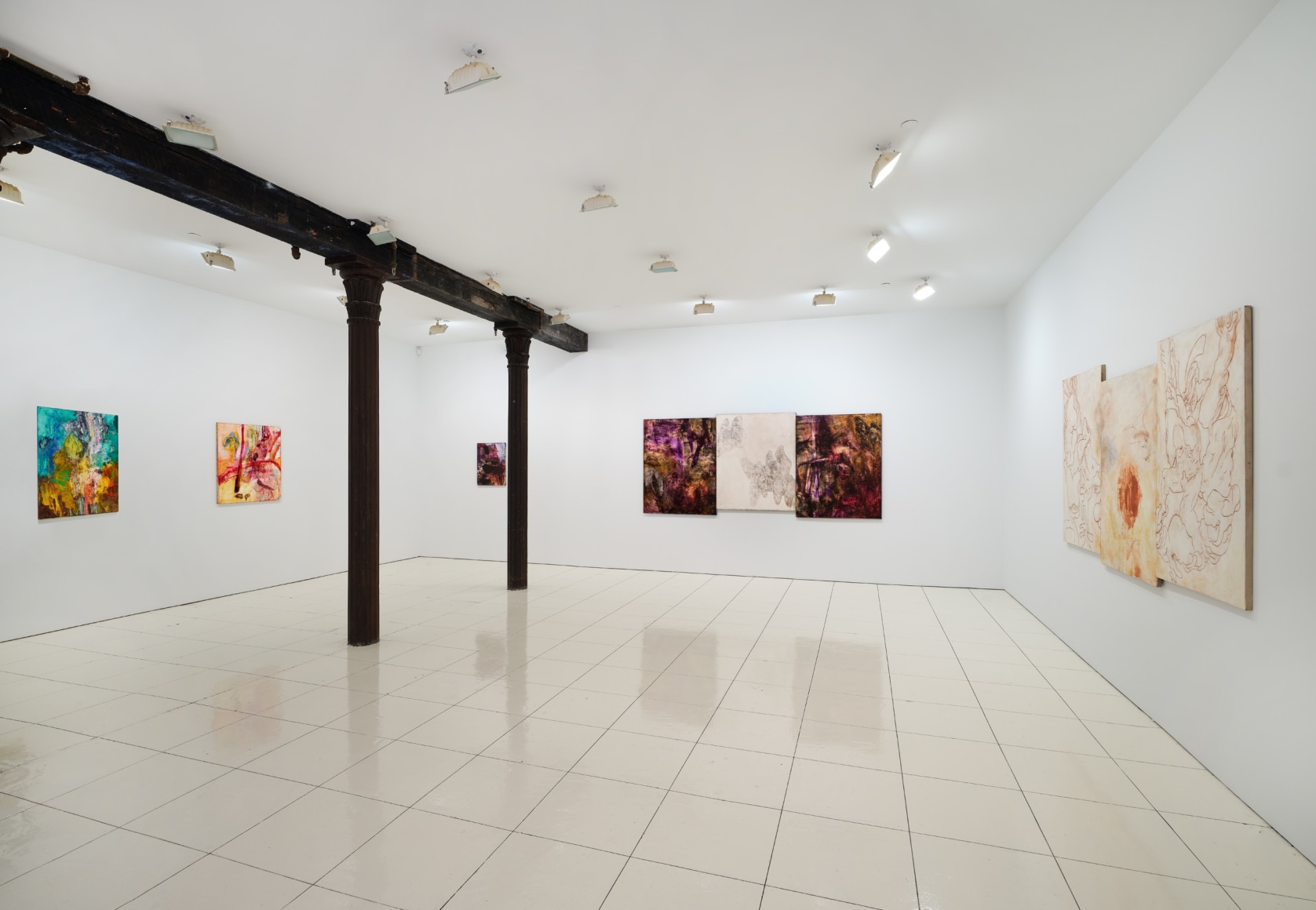 Installation view of Bill Jensen's Wandering Boundless and Free featuring colorful, abstract paintings