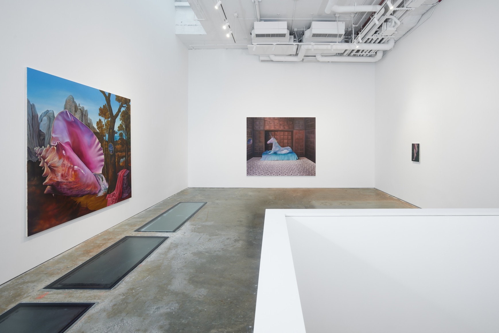 Paintings by Ariana Papademetropoulos on a wall in a gallery