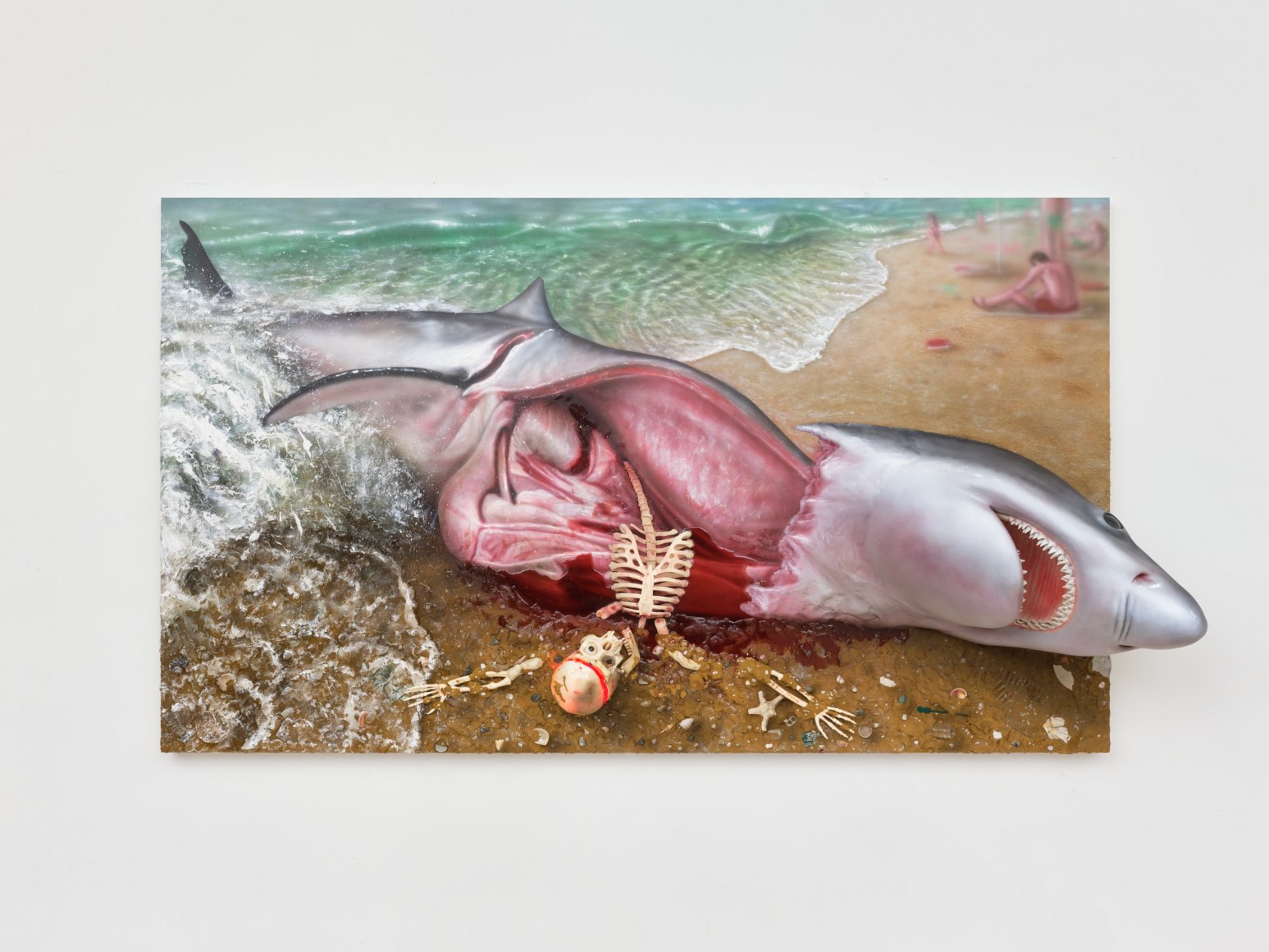 shark with skeleton coming out of its belly washed up on the shore