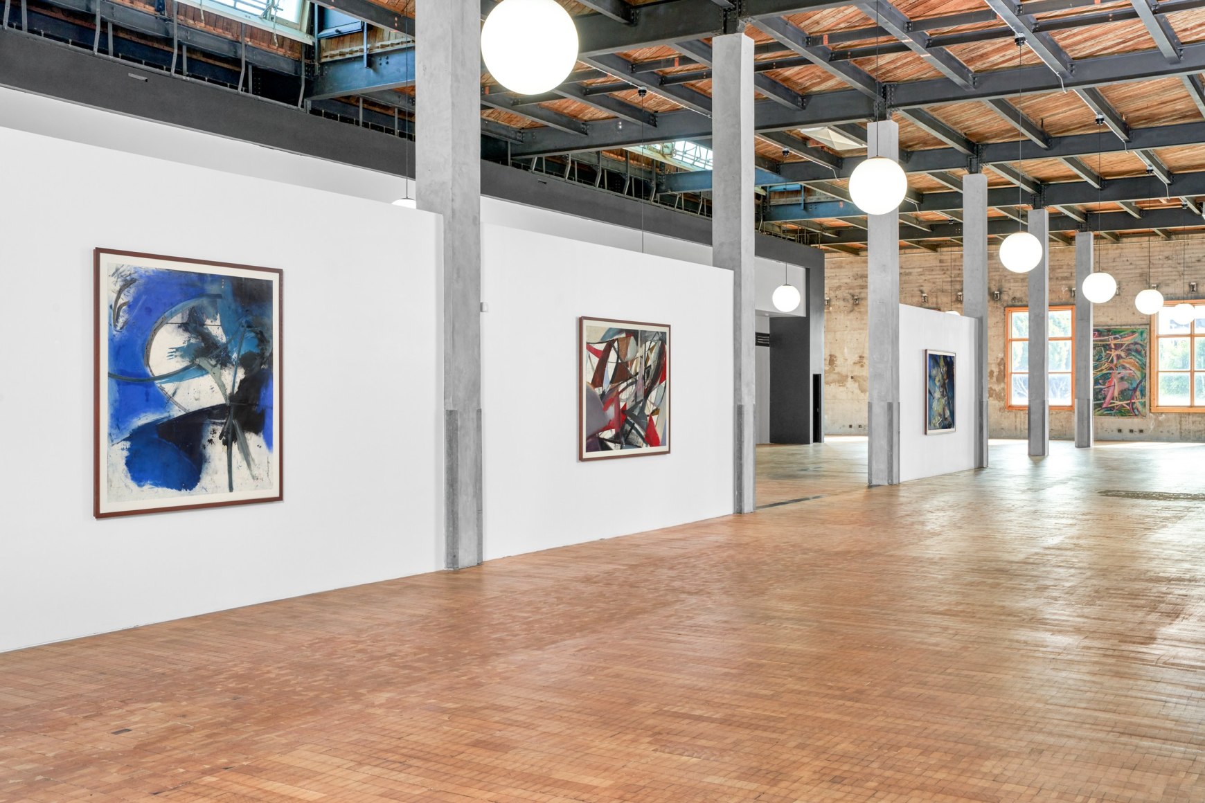 Installation view of Mariana Oushiro Paintings in a post office