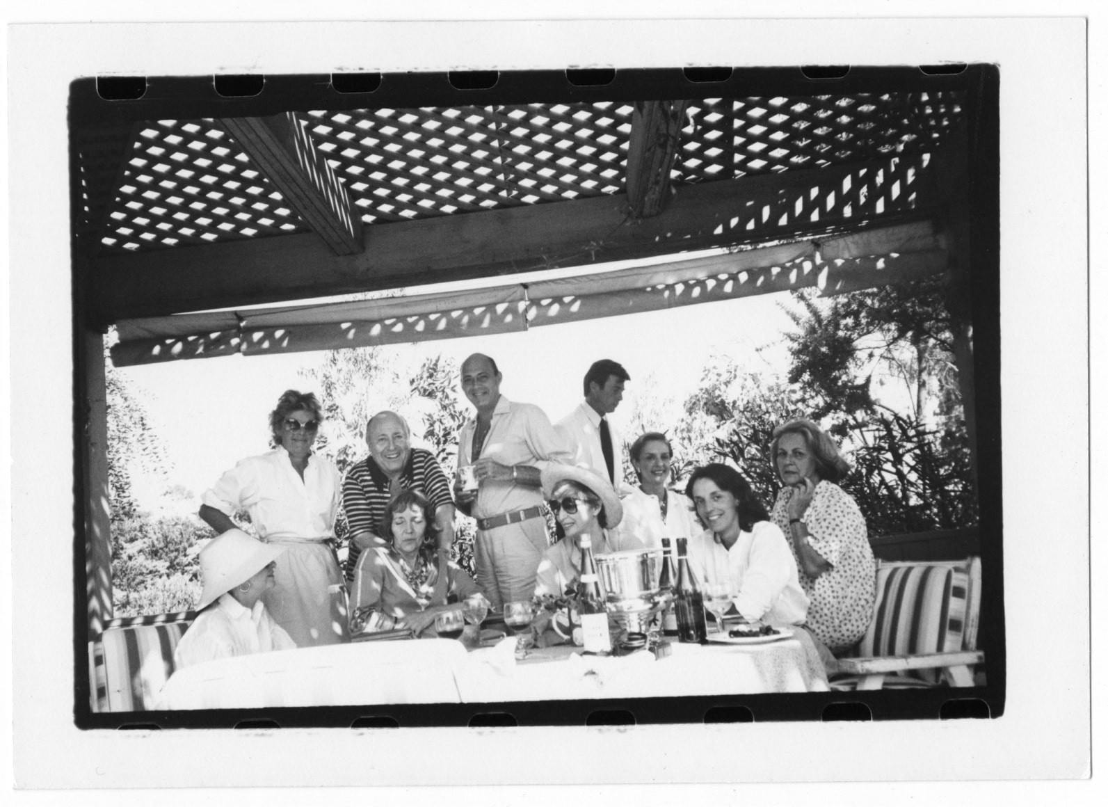 Marguerite Littman, Josephine Loewenstein, Jerry Zipkin, Ellen Griffin Dunne, Reinaldo Herrera, Unidentified Woman, Waiter, Carolina Herrera, Melissa Wyndham, and Camilla McGrath, Los Angeles, 1982
