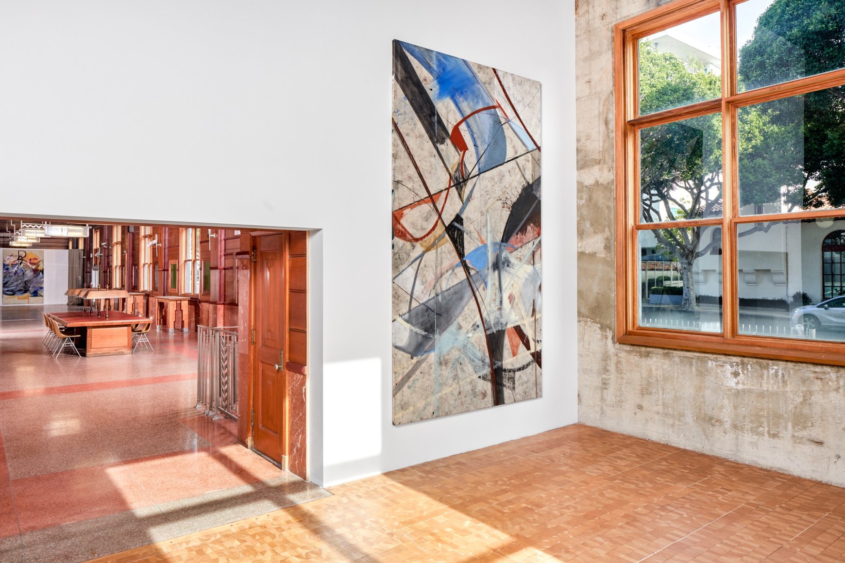 Installation view of Mariana Oushiro Paintings in a post office