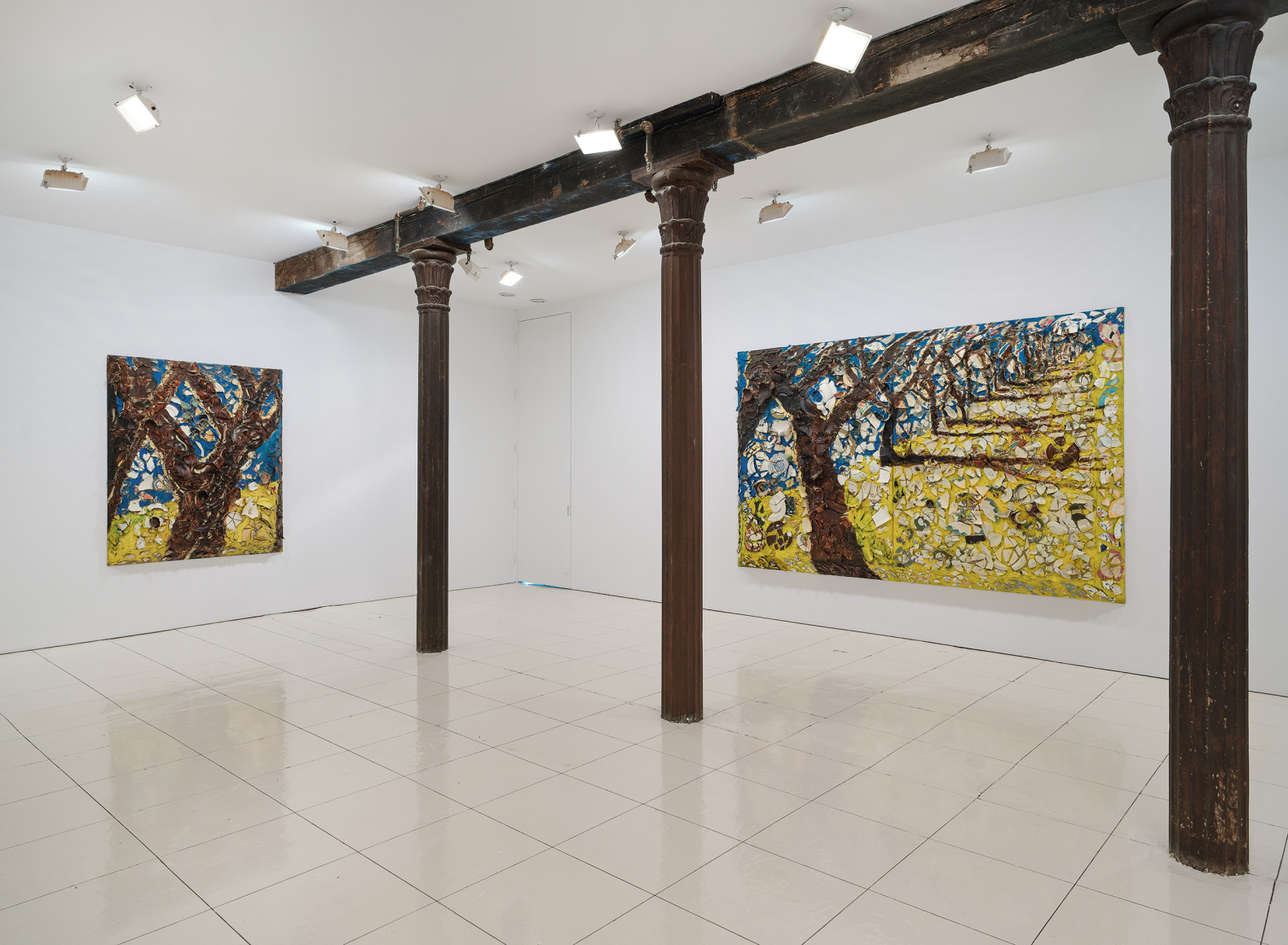 Installation view of Julian Schnabel plate paintings of trees