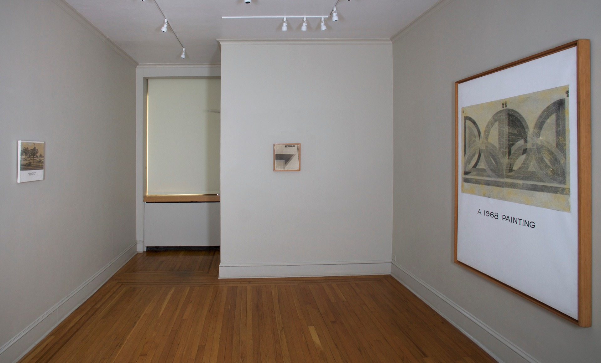 From Left: John Baldessari 30th and National, National City, 1966-67. Photographic emulsion, acrylic, and printed type on canvas. 12 3⁄8  x 12 1 ⁄2  inches. Frances F. Bowes, San Francisco. John Baldessari Artforum, 1966-67. Photographic emulsion and acrylic on canvas. 12 1⁄8 x 12 1⁄4 inches. Private collection. John Baldessari A 1968 Painting, 1966-68. Photographic emulsion, acrylic, and pencil on canvas. 59 x 45inches. Private collection.