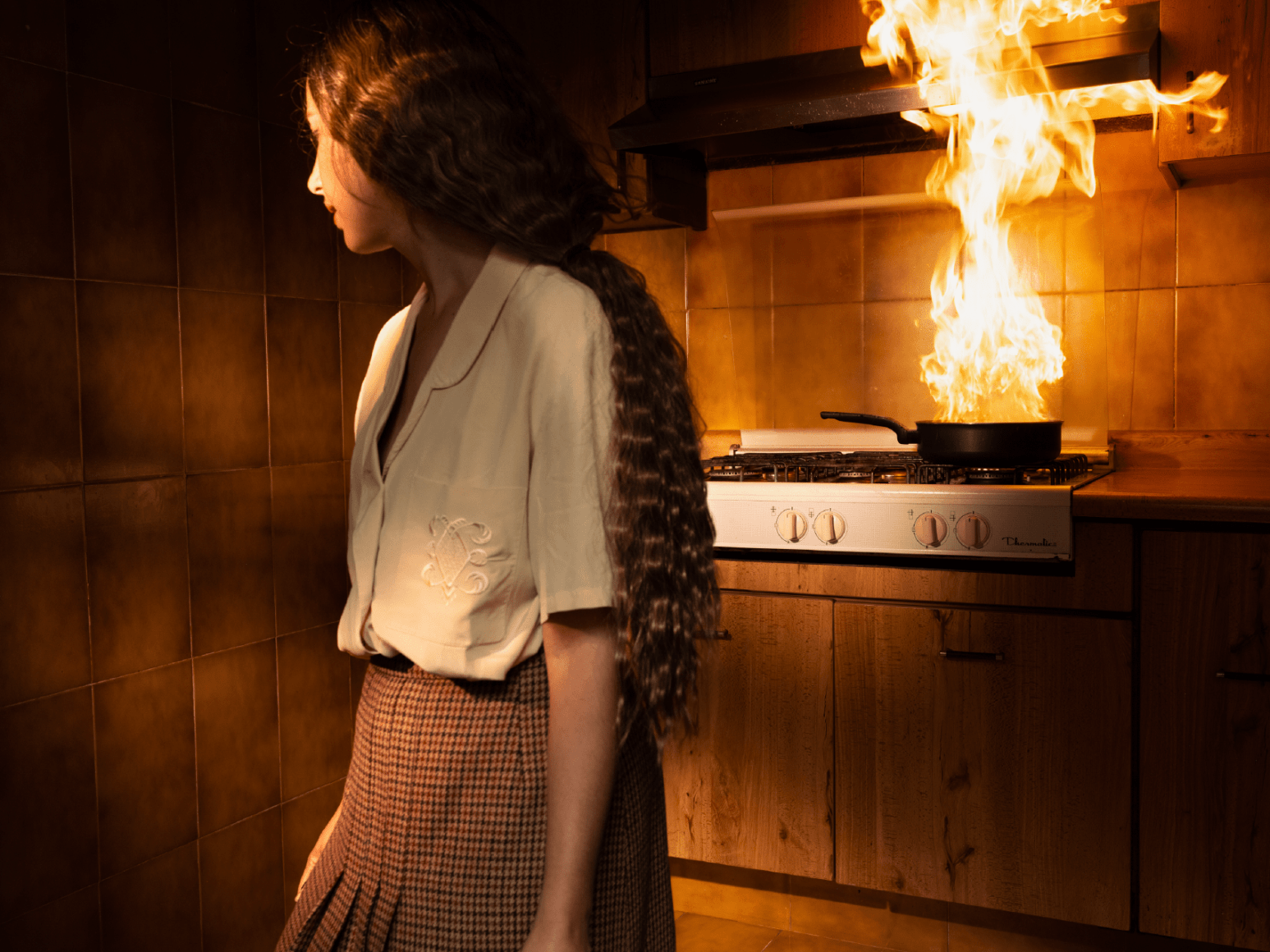 Tania Franco Klein, Pan, Fire, Kitchen (Self-portrait), 2022, from the series Break in Case of Emergency. Archival pigment print.