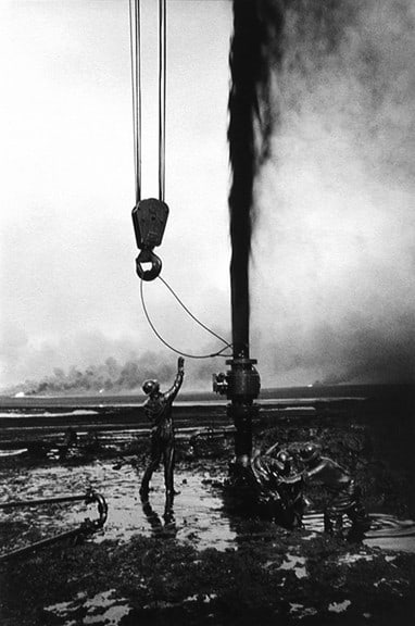 Shooting oil, Kuwait, from the series Workers, 1991, 20 x 16, 24 x 20, 35 x 24, 50 x 36 or 68 x 50 inch gelatin silver print