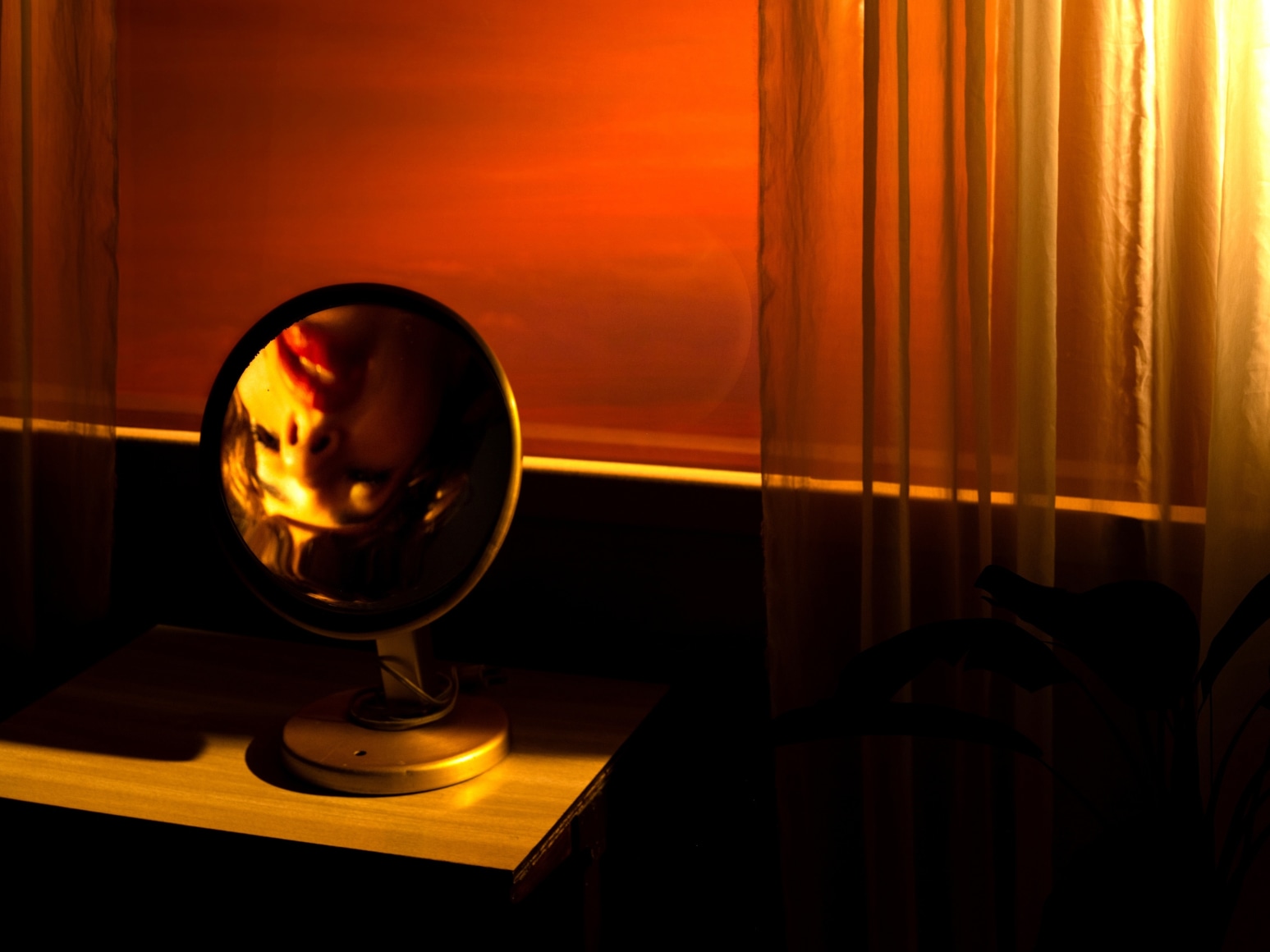 Tania Franco Klein,&nbsp;Rounded Mirror, Window (Self-portrait),&nbsp;2022, from the series Break in Case of Emergency. Archival pigment print, 29 1/2 x 39 3/8 inches.