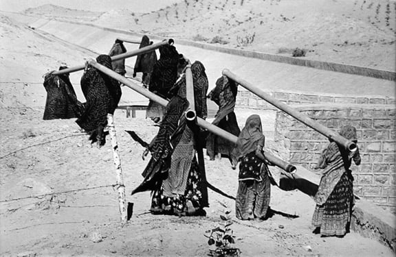 Women Carrying Pipes, Rajasthan Canal Works, India, from the series Workers, 1989. 16 x 20, 20 x 24, 24 x 35, 36 x 50 or 50 x 68 inch gelatin silver print