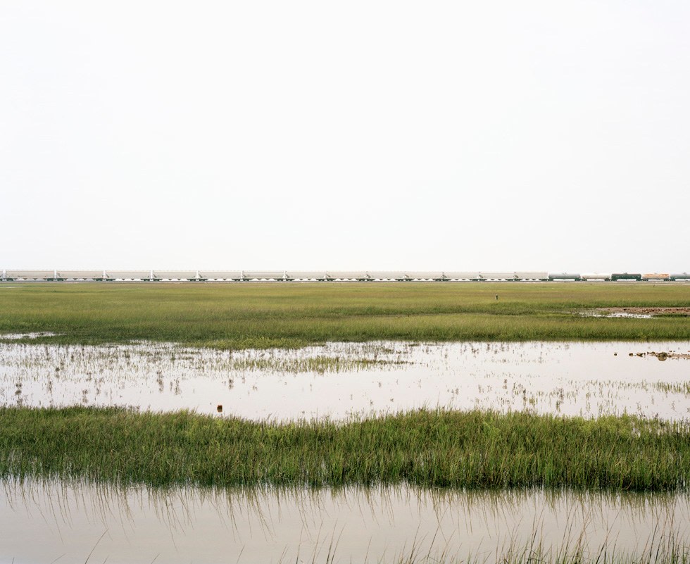 Untitled (Trains Crossing Estuarial Corridor-3), Virginia Point, Texas, 2015.