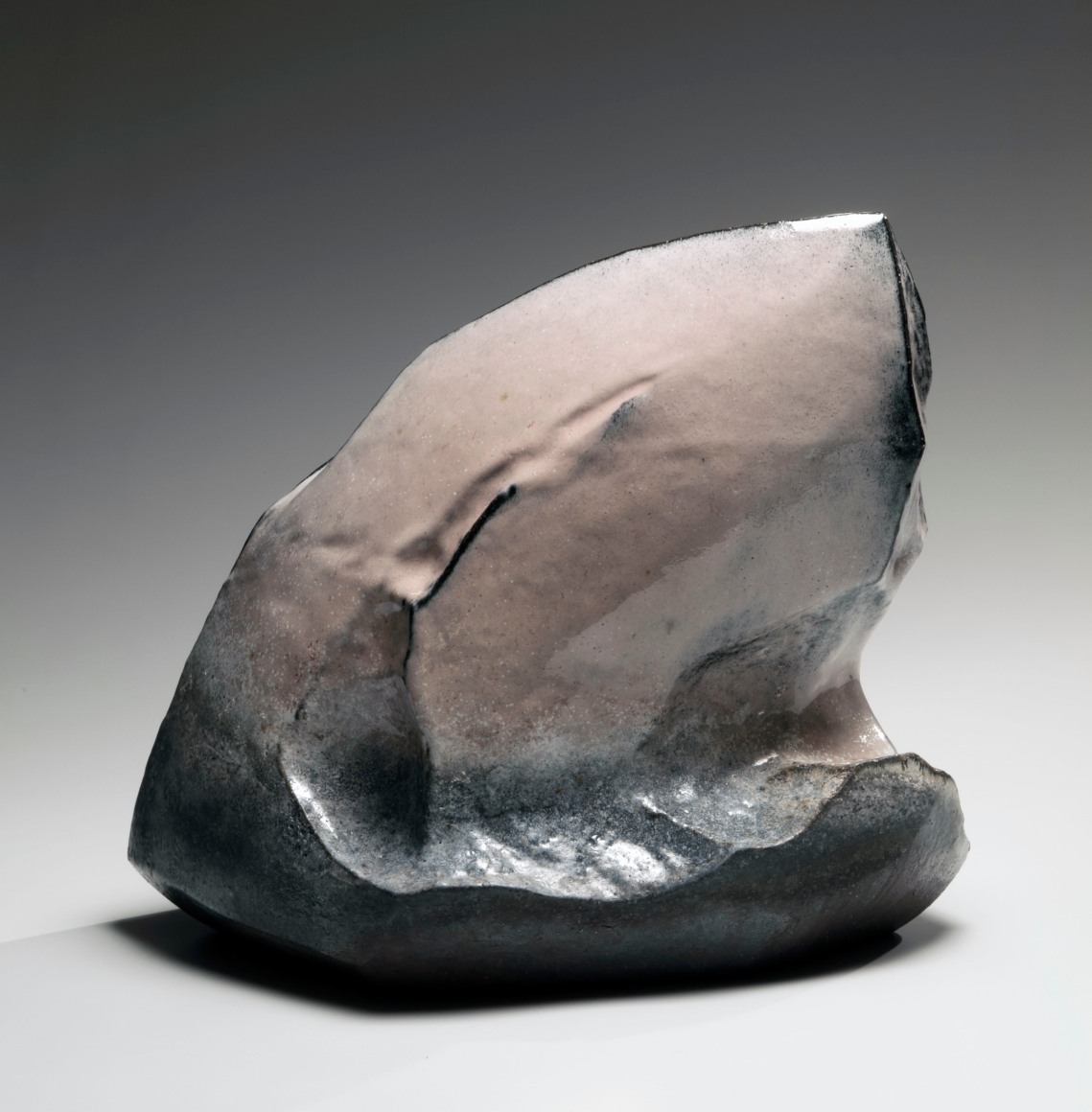Kaneta Masanao (b. 1953), Rock-like, scooped-out vessel with multi-planed body, unctuous Hagi&nbsp;glazes with kiln effects