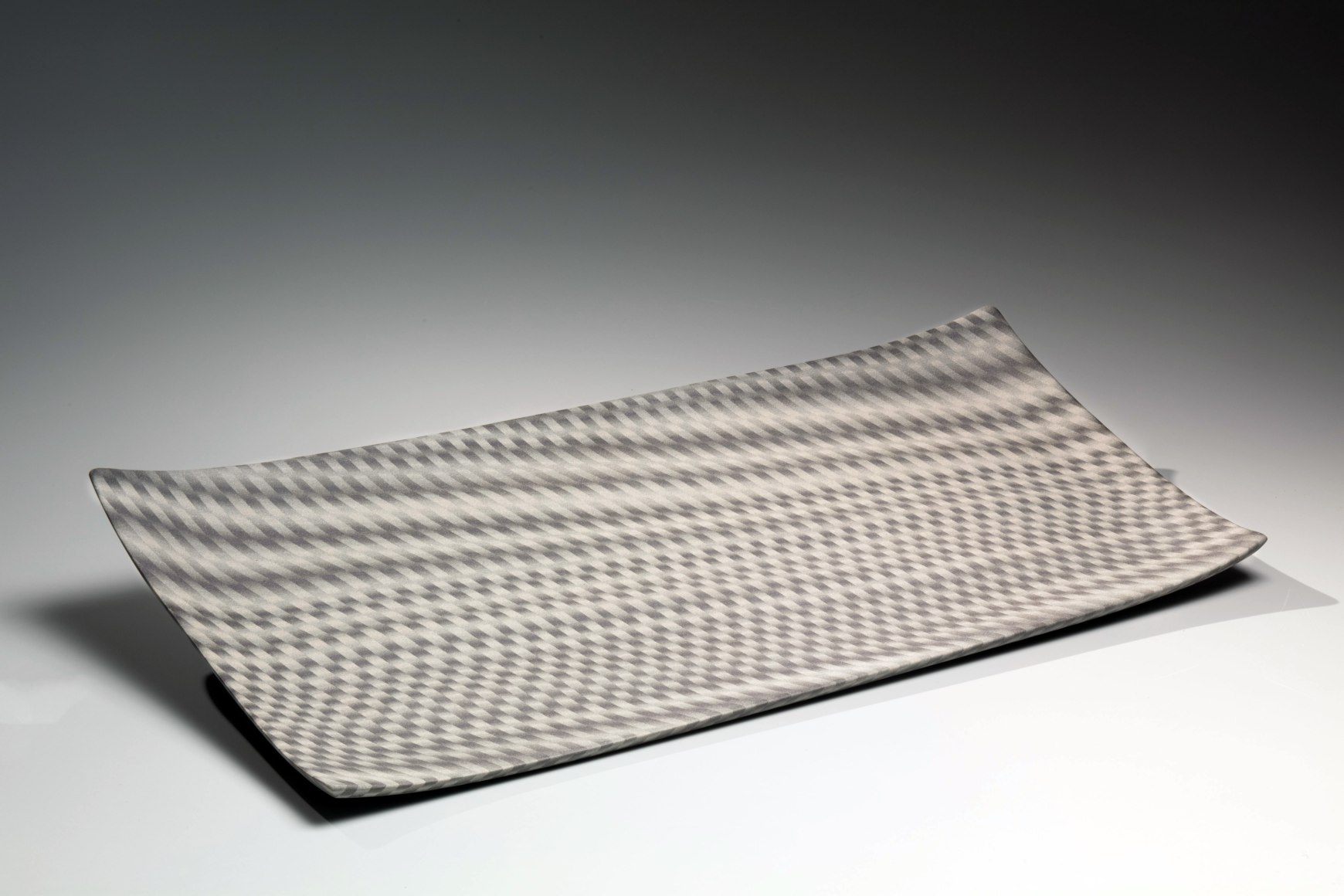 Rectangular plate with optical design of seemingly billowing curtains, 2006