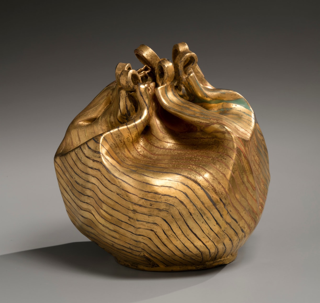 Gold-glazed drawstring bag-shaped sculpture