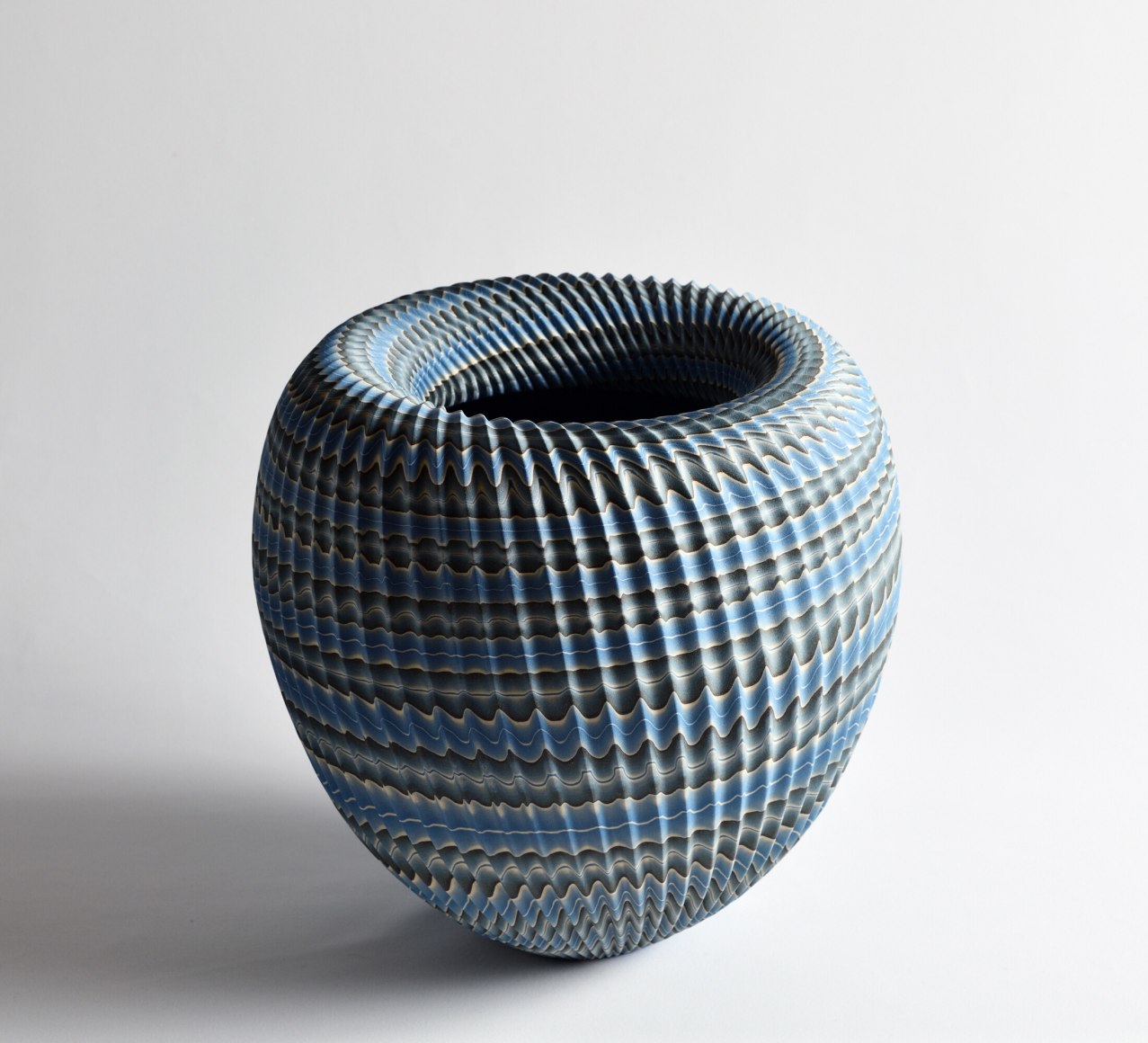 Ogata Kamio (b. 1949), Neriage (marbleized) vessel with carved, ridged surface and rolled collar titled &quot; Abyss&quot;