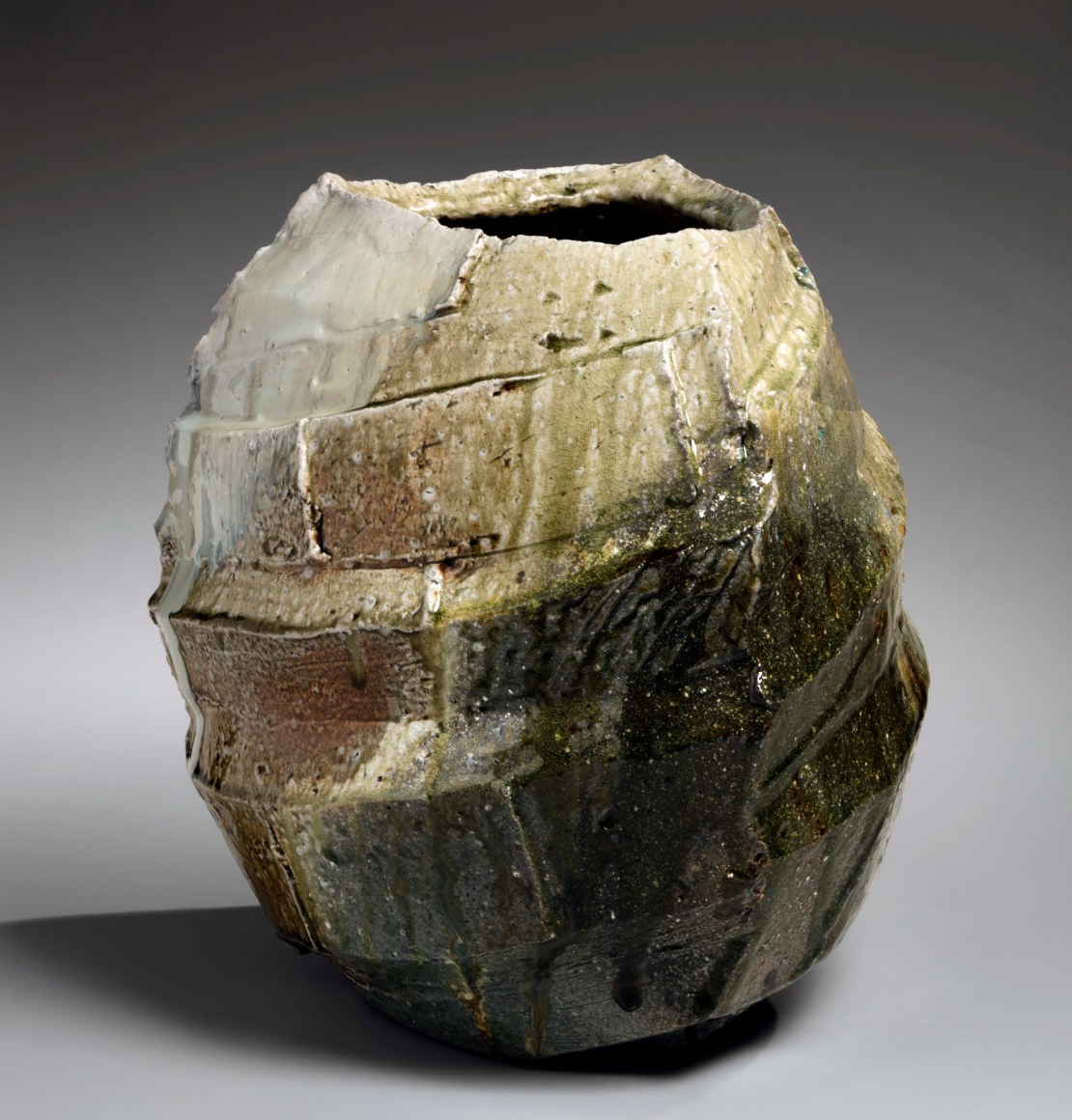 Thickly walled vessel with diagonally carved bands covered in a thick Tamba-style ash glaze&nbsp;, 2019