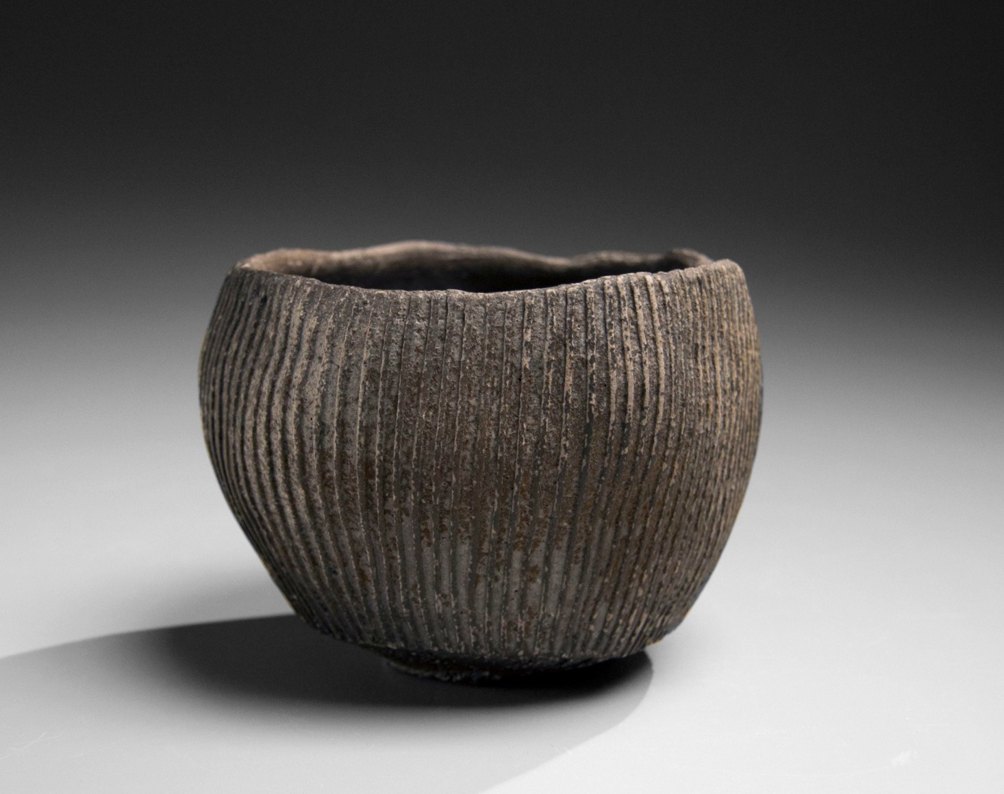 Round teabowl decorated with carved linear patterning in relief, 2016