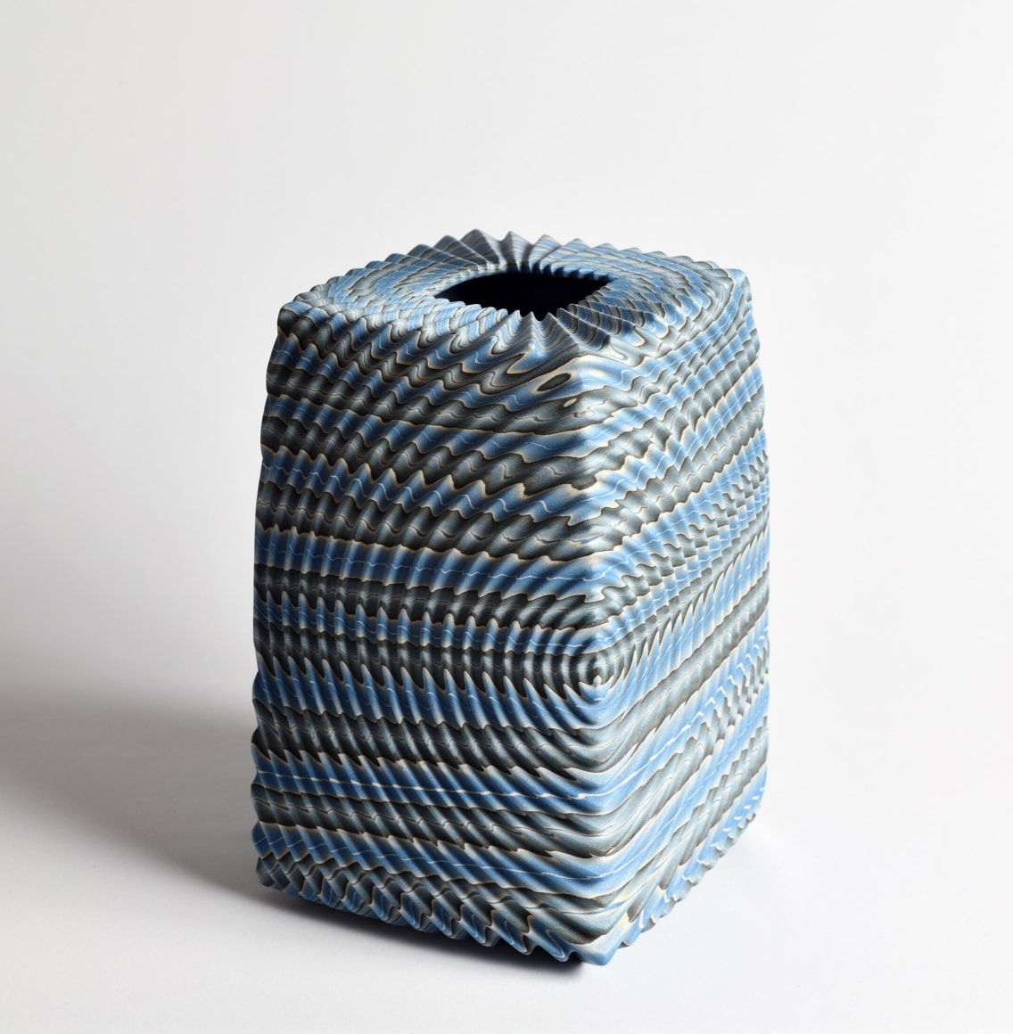 Ogata Kamio (b. 1949), Neriage (marbleized) vessel with&nbsp;carved, ridged surface and recessed square mouth titled &ldquo;Waves&rdquo;