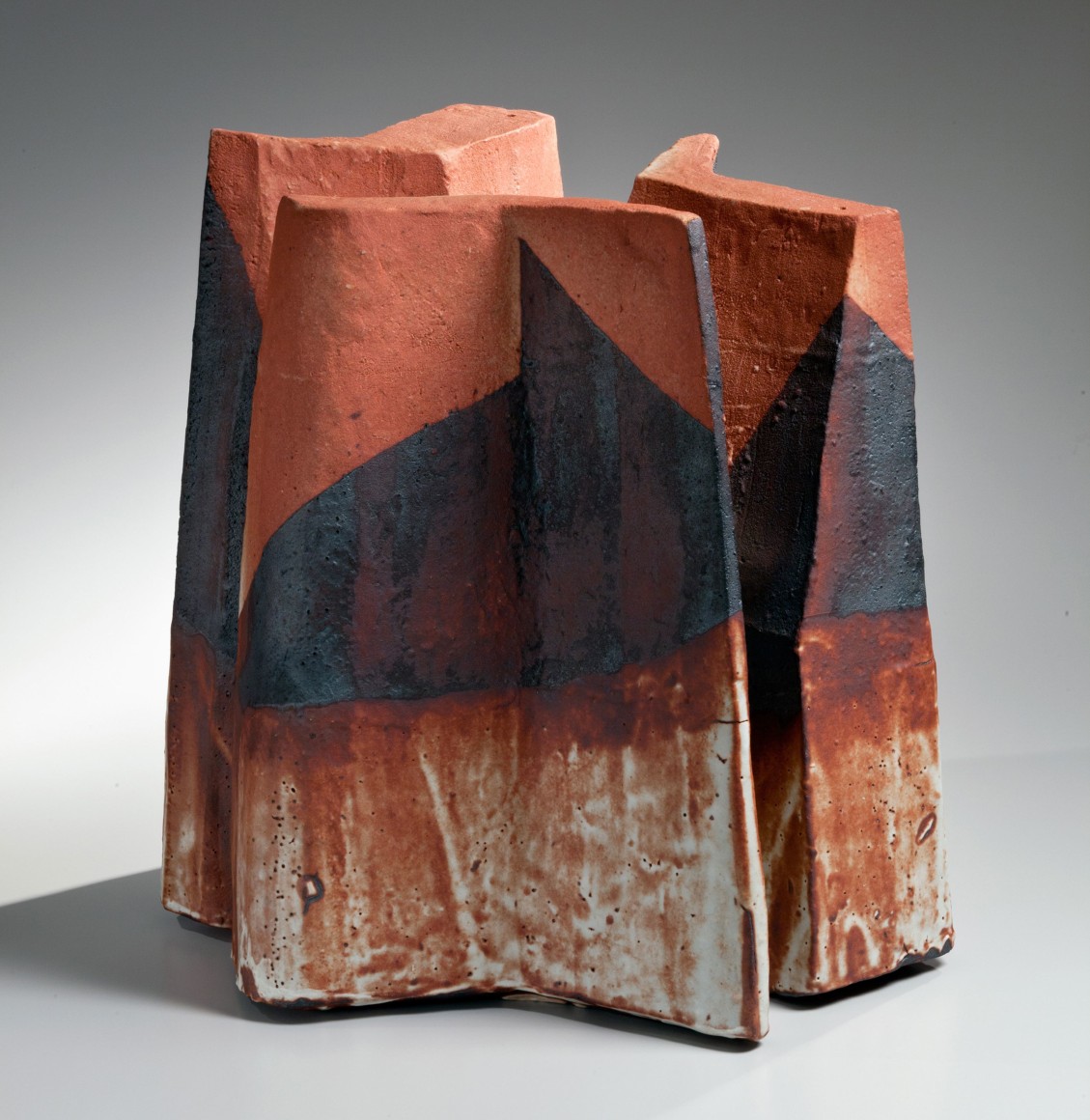 Three thick, folded slabs joined at the center to form a large standing Shino-glazed vessel, ca. 1985