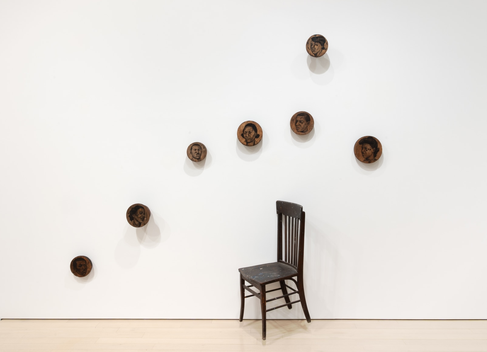 Whitfield Lovell The Company You Keep, 2002 Charcoal on wood with chair 100 x 112 x 25 inches