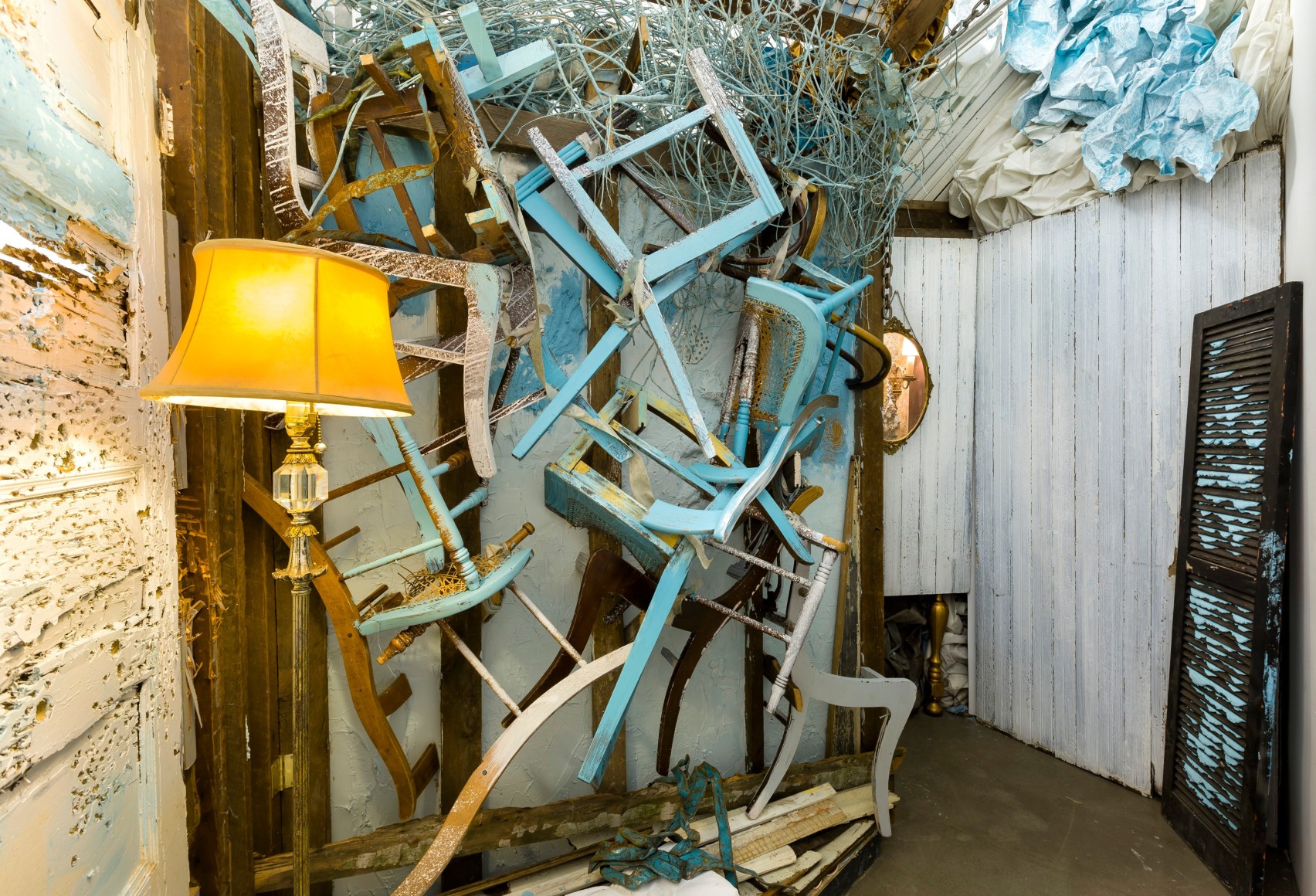 Large installation by Julie Schenkelberg including reclaimed wood and household materials