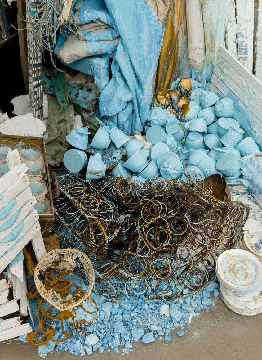 Large installation by Julie Schenkelberg including reclaimed wood and household materials